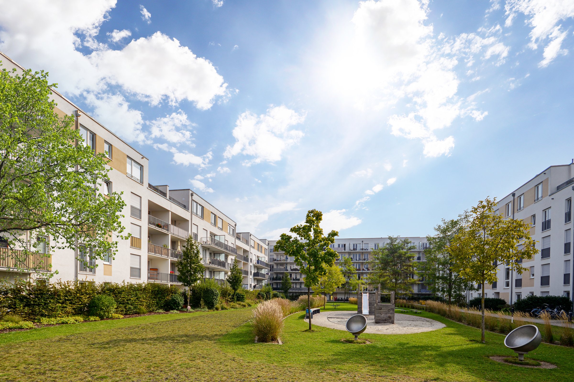 Cityscape of a residential area with modern apartment buildings, new green urban landscape in the city