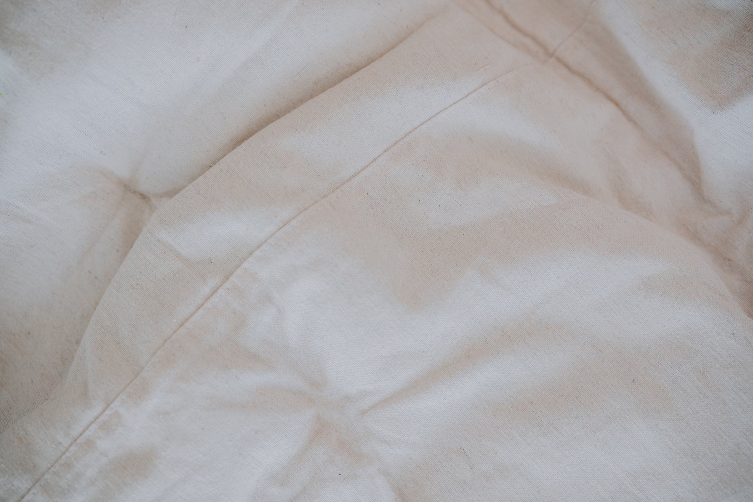 Crisp white linens create a tranquil and inviting atmosphere in the bedroom.