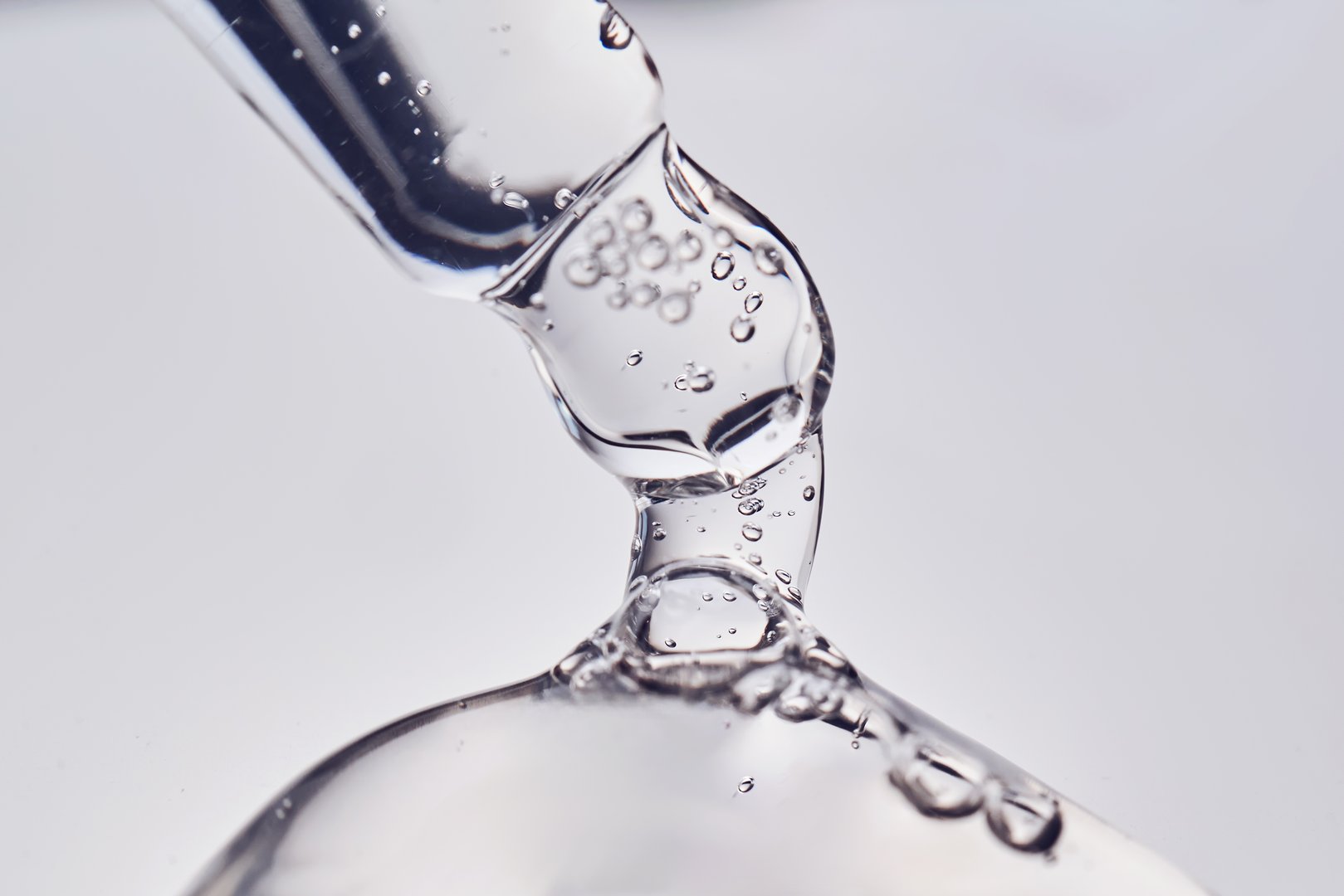 Pipette with cosmetic gel or serum close-up. High quality photo.