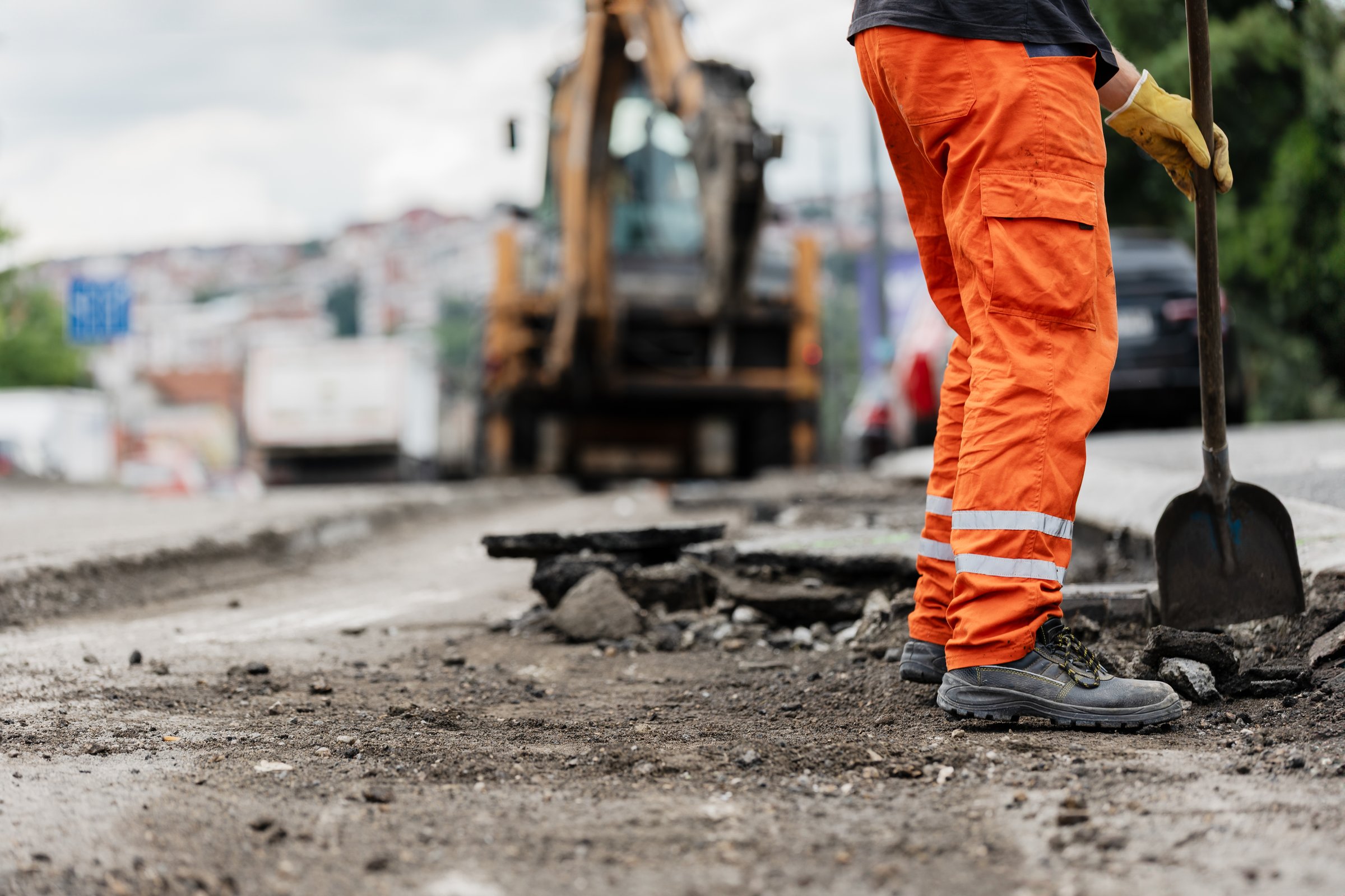 Construction worker repairing road