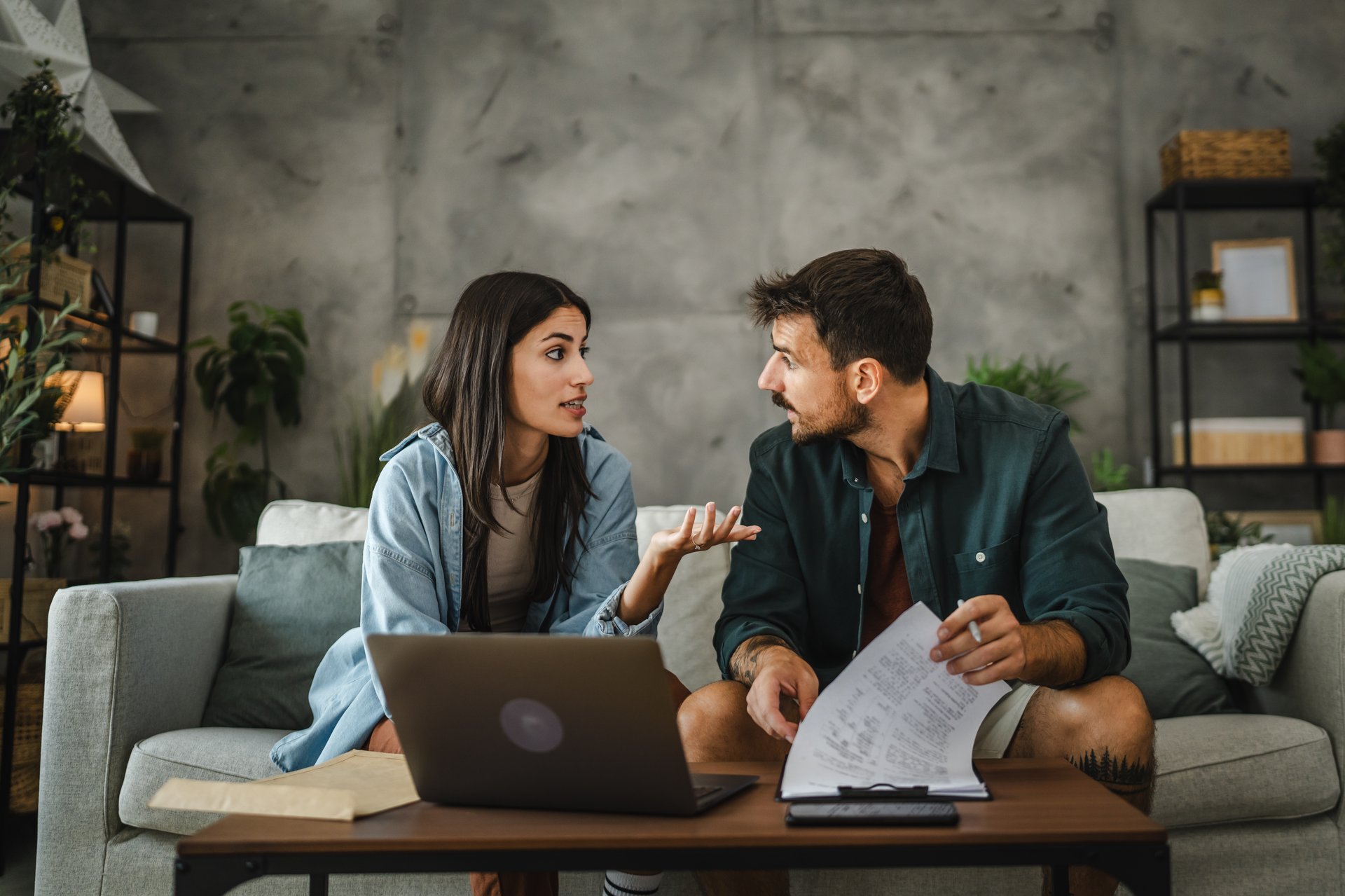 Adult caucasian couple girlfriend and boyfriend work from home and use laptop