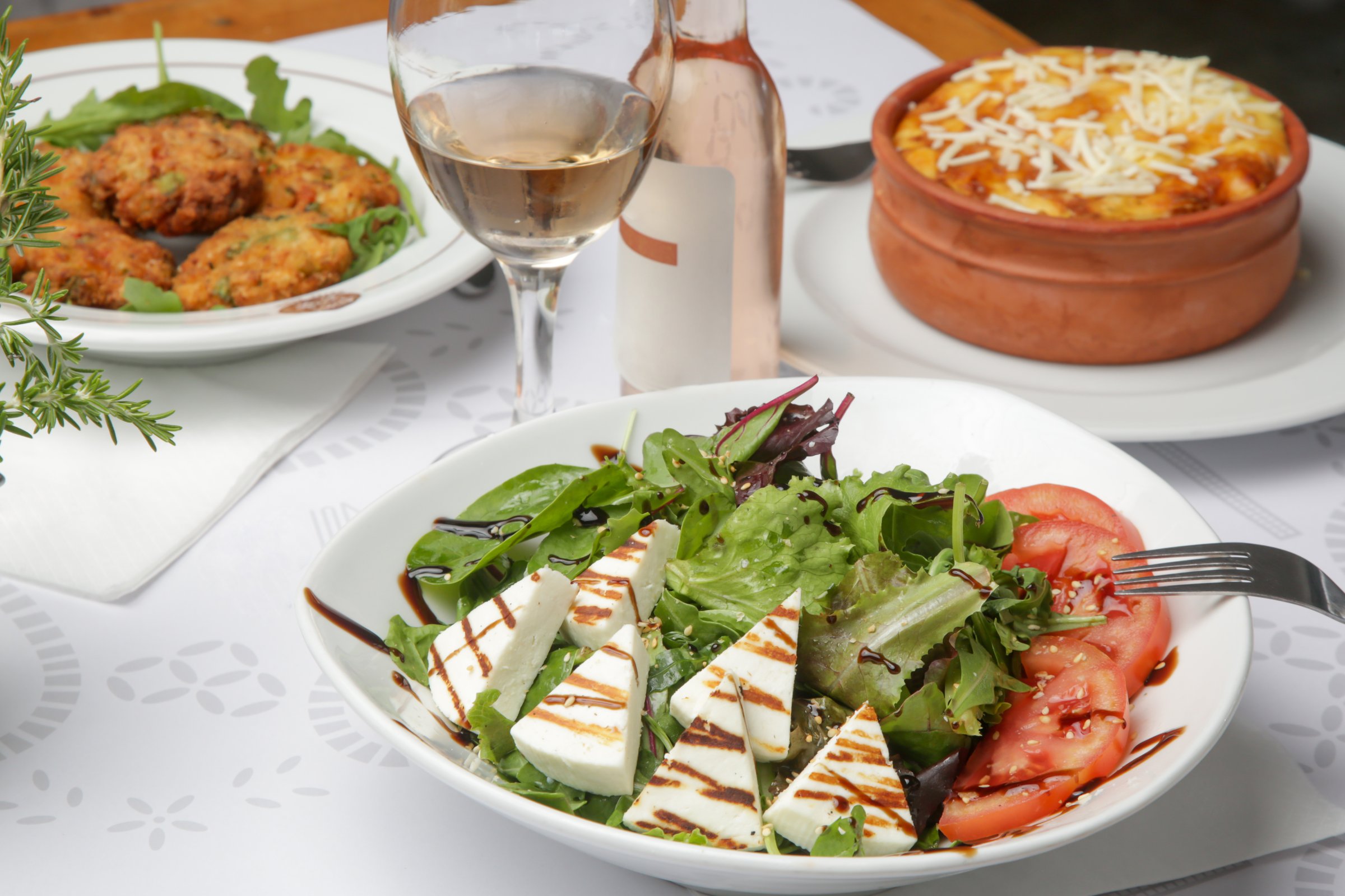 Various Mediterranean dishes served on the restaurant table
