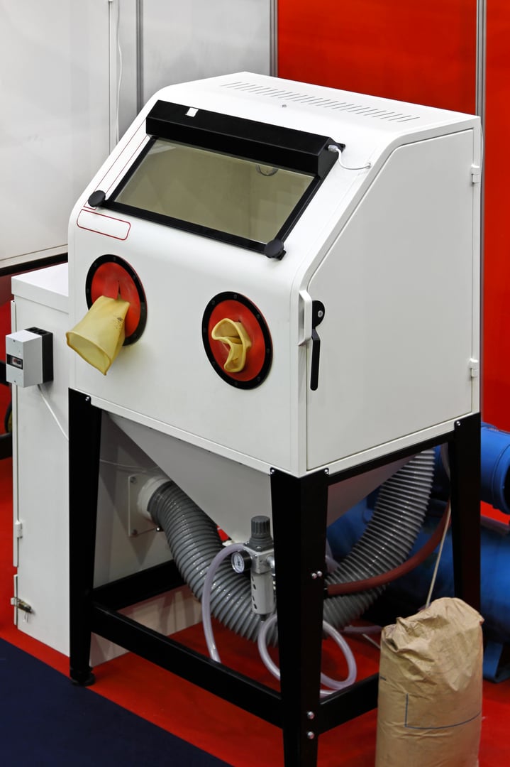 Sand blasting cabinet in metal work shop