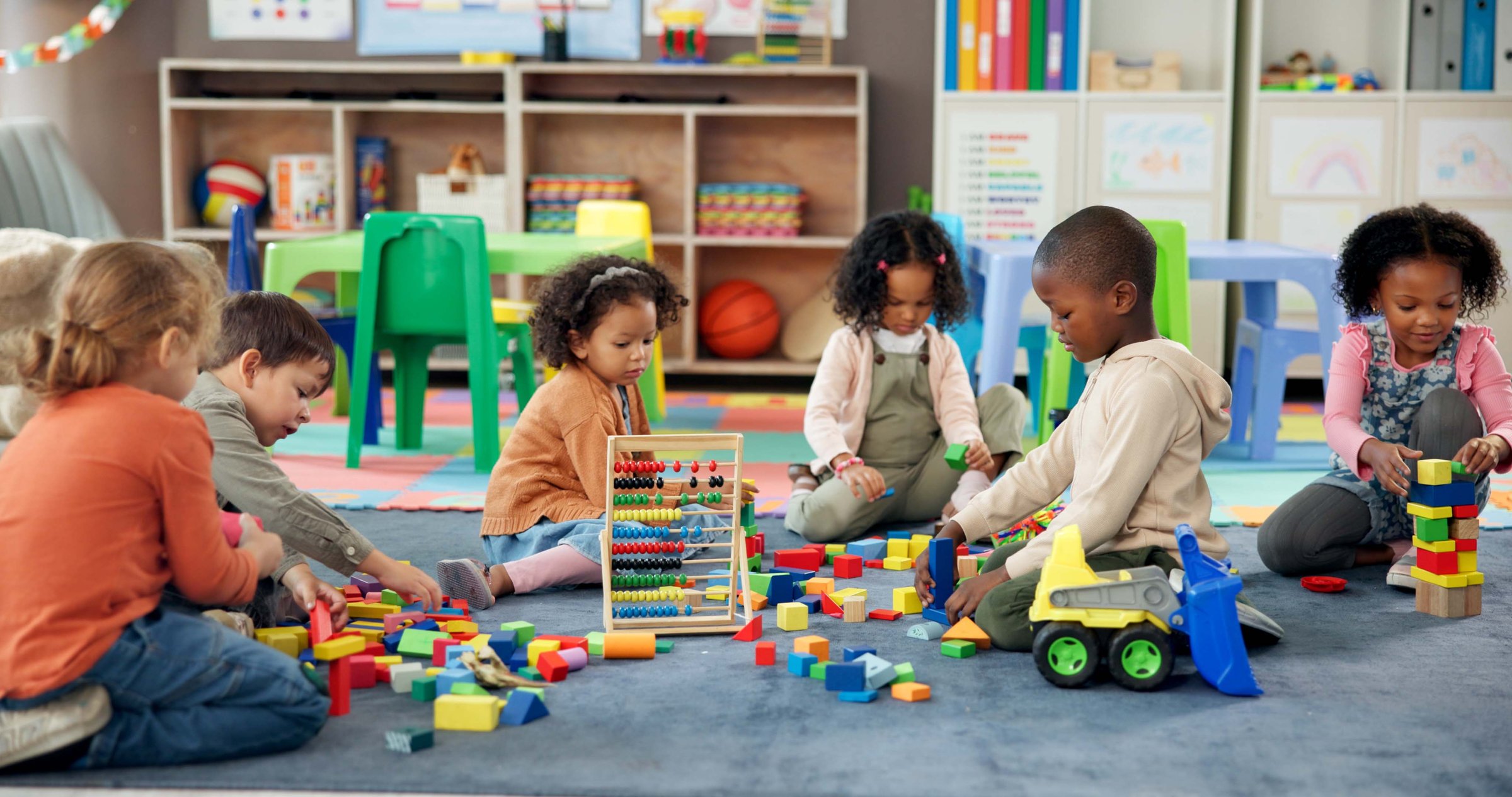 Kids playing with blocks in classroom