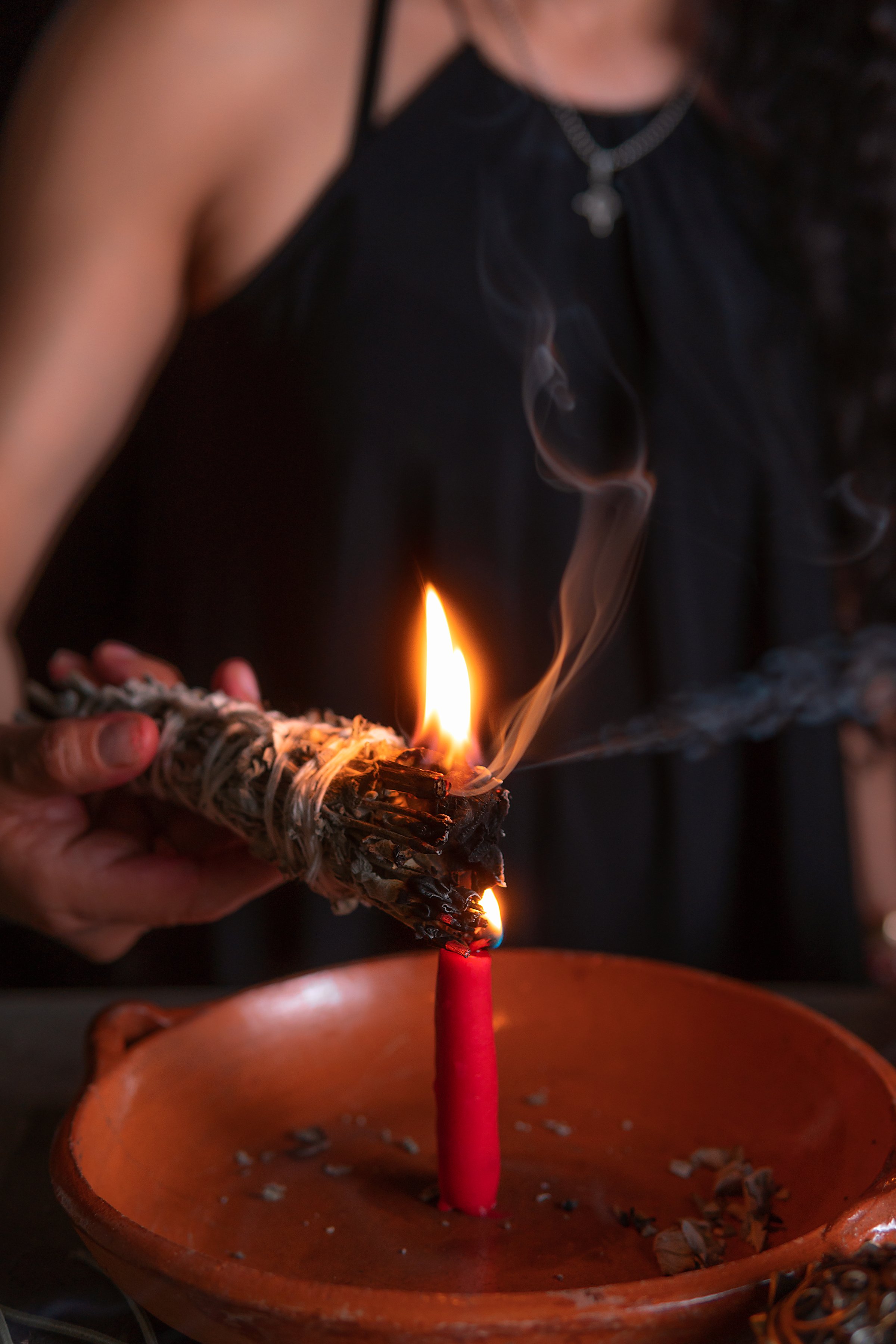 lighting an incense, witch on the eve of all saints&#039; eve performing a cleansing ritual, Halloween, spiritual beliefs, white magic