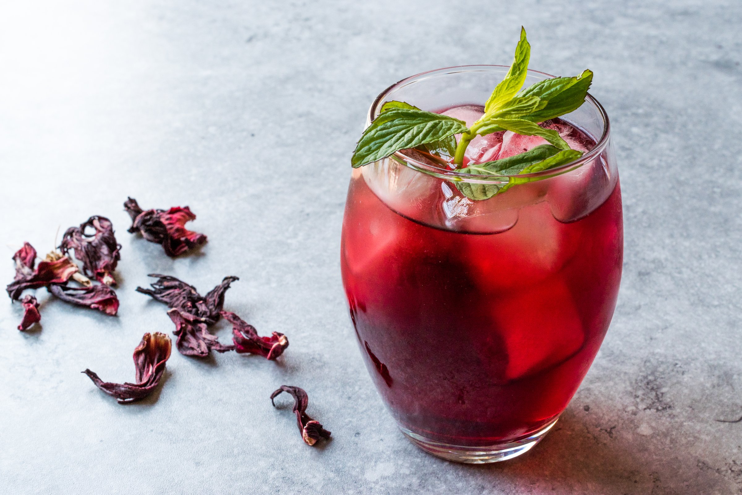 Cold Brew Hibiscus Tea with ice and Mint Leaves. Summer Beverage.
