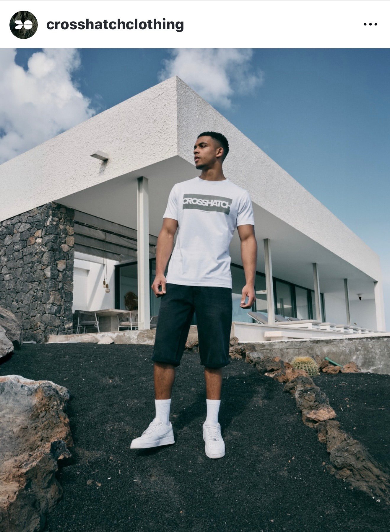Male model showcasing Crosshatch t-shirt in modern outdoor fashion shoot