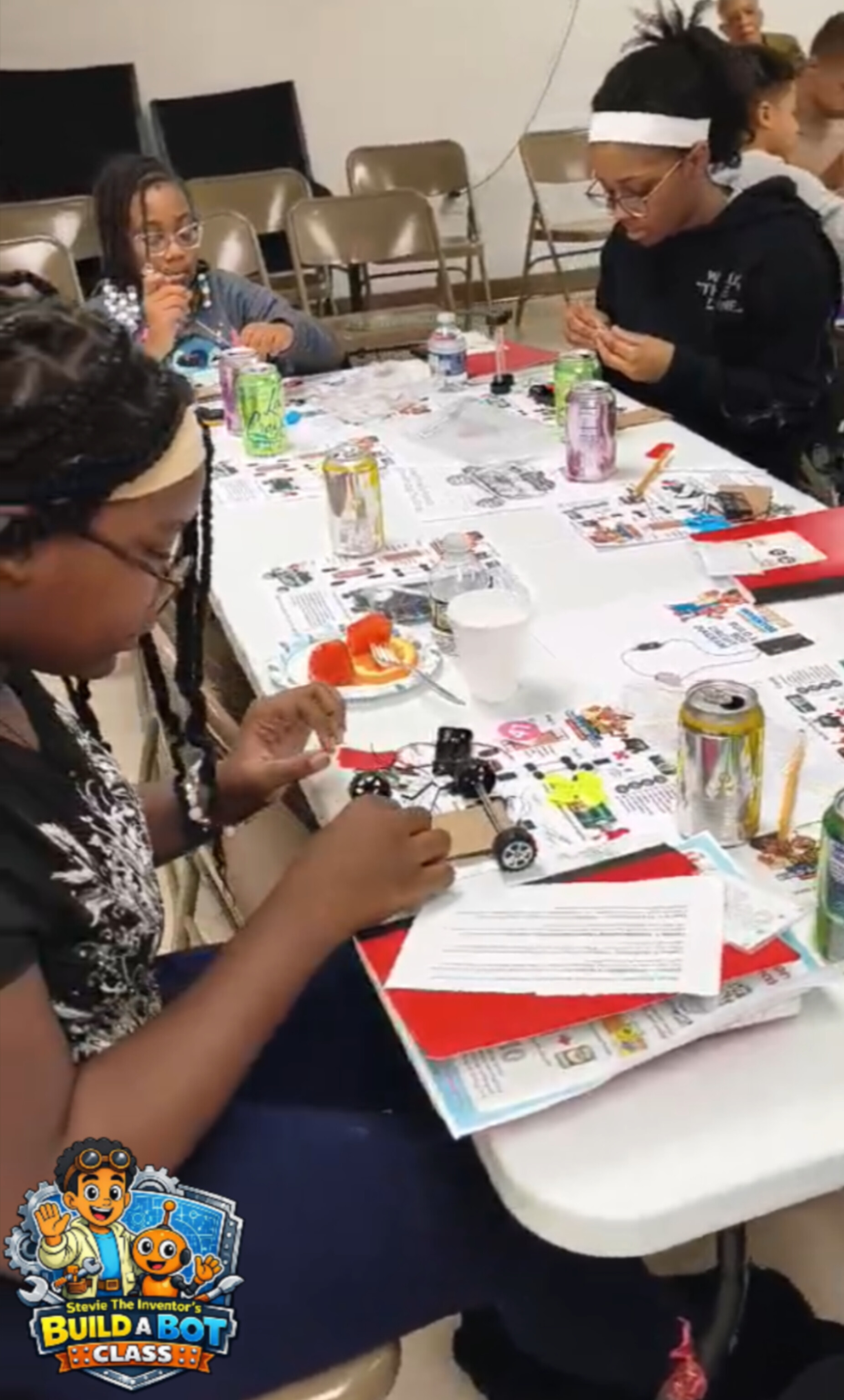 Child building robot with sensors in Junior Engineers class