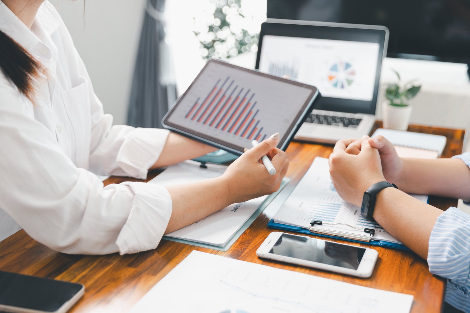 Teamwork meeting, business people in office workplace. Collaboration, technology and worker, employees with touchscreen planning sales, research or financial strategy, staff for conversation, graph