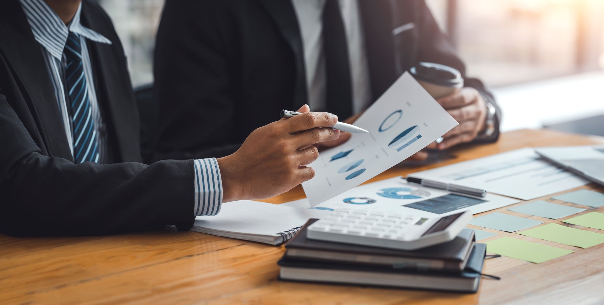 Team of business people working together discussion and analysis data chart and graph, finance and accounting at meeting.