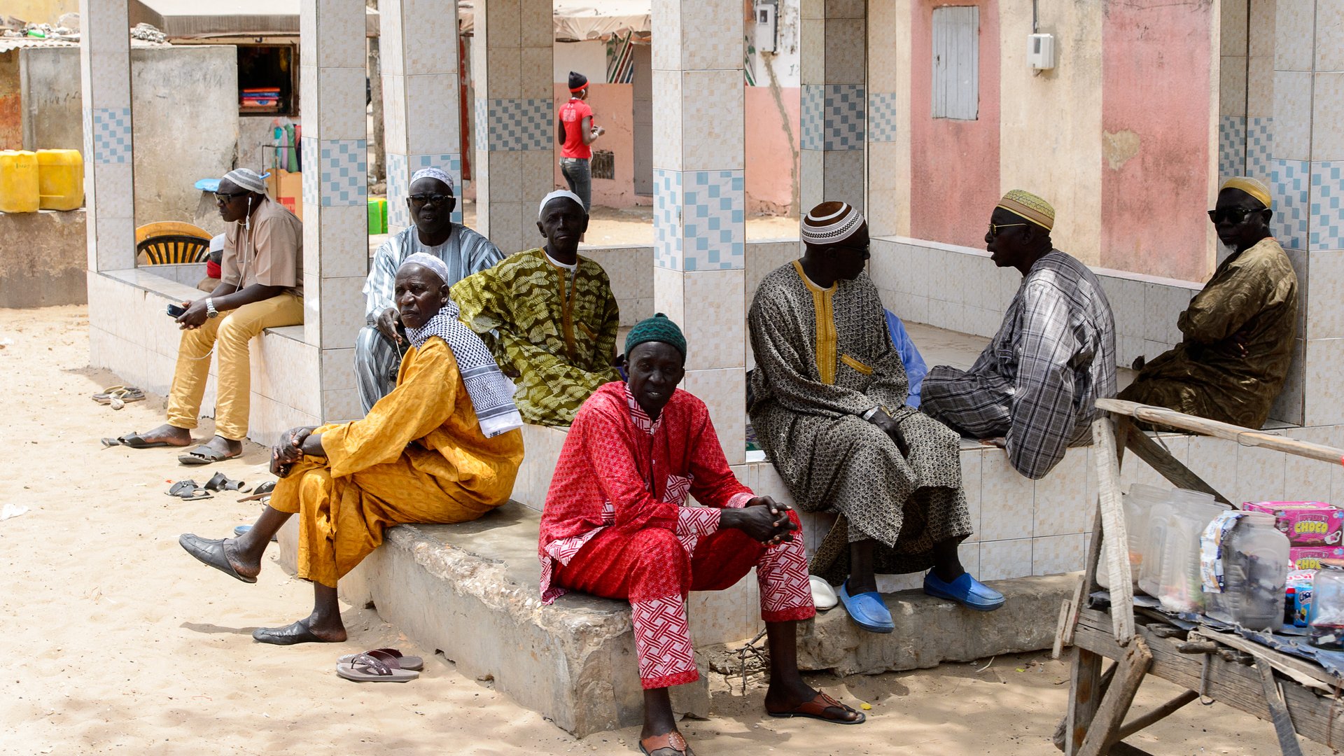 LAC ROSE reg. , SENEGAL - APR 27, 2017: Unidentified Senegalese group of men sit on the bricks.