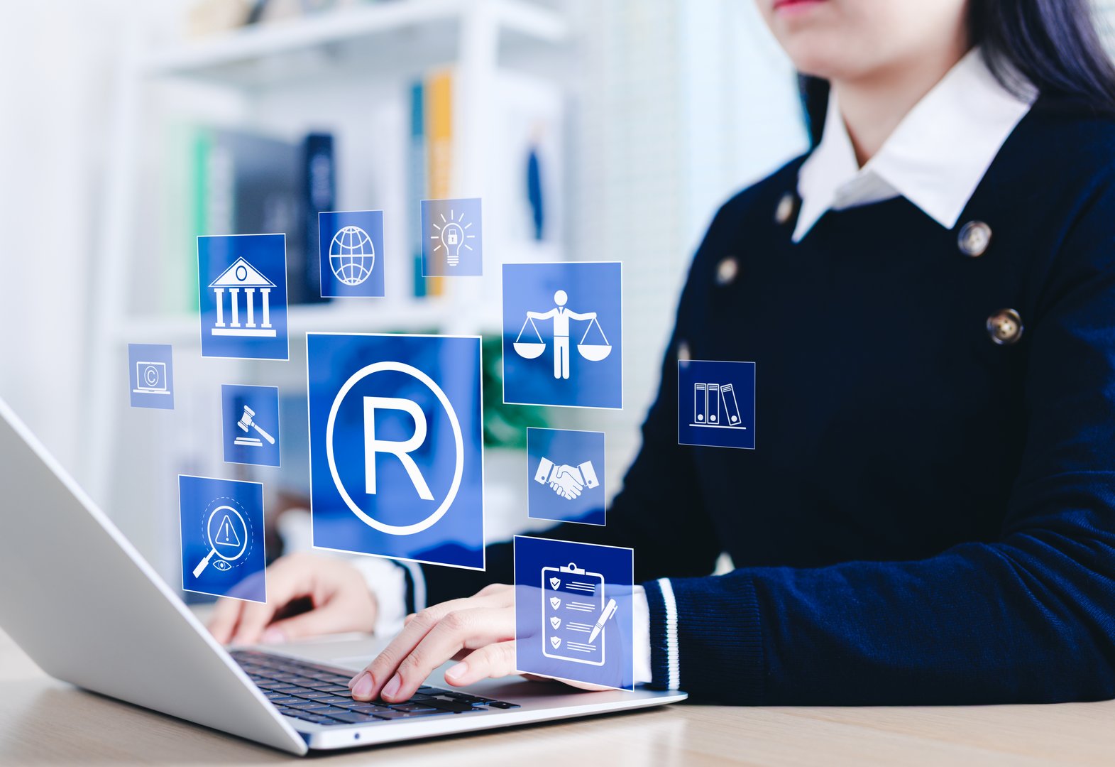 Registered trademark and intellectual property concept. Business professional working with digital trademark, copyright, and intellectual property icons, legal protection, patents, and brand security.