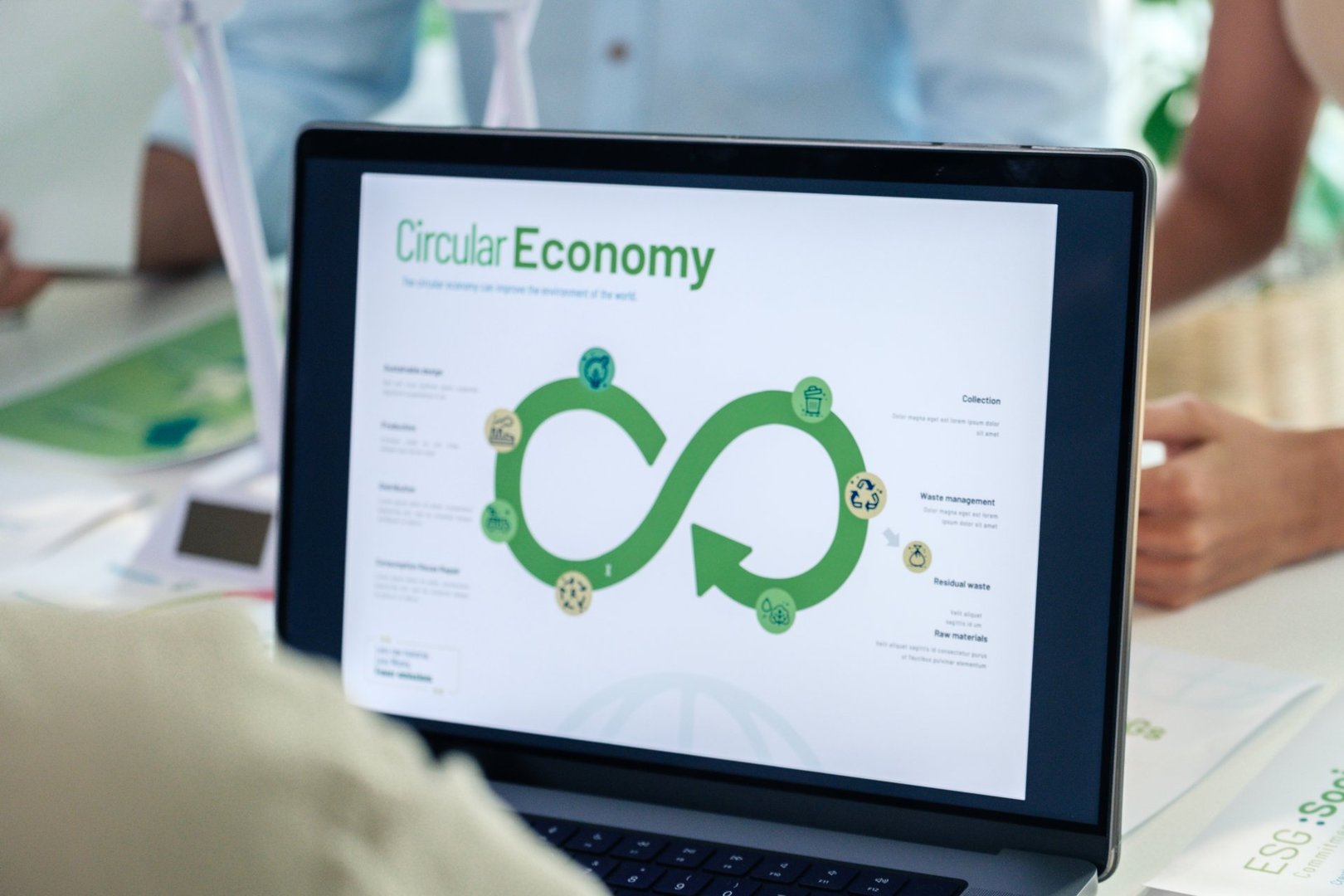 ESG ( environment, social,governance) recycle sign on laptop screen with carbon free chart board in office