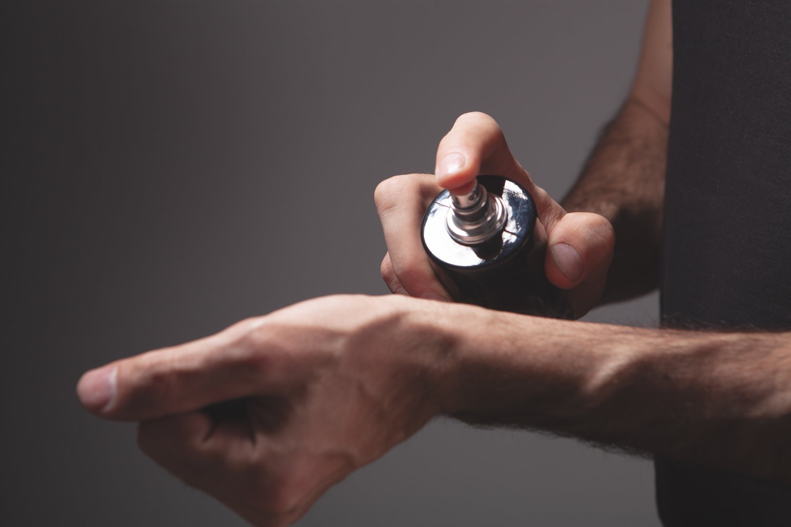hand with bottle of perfume