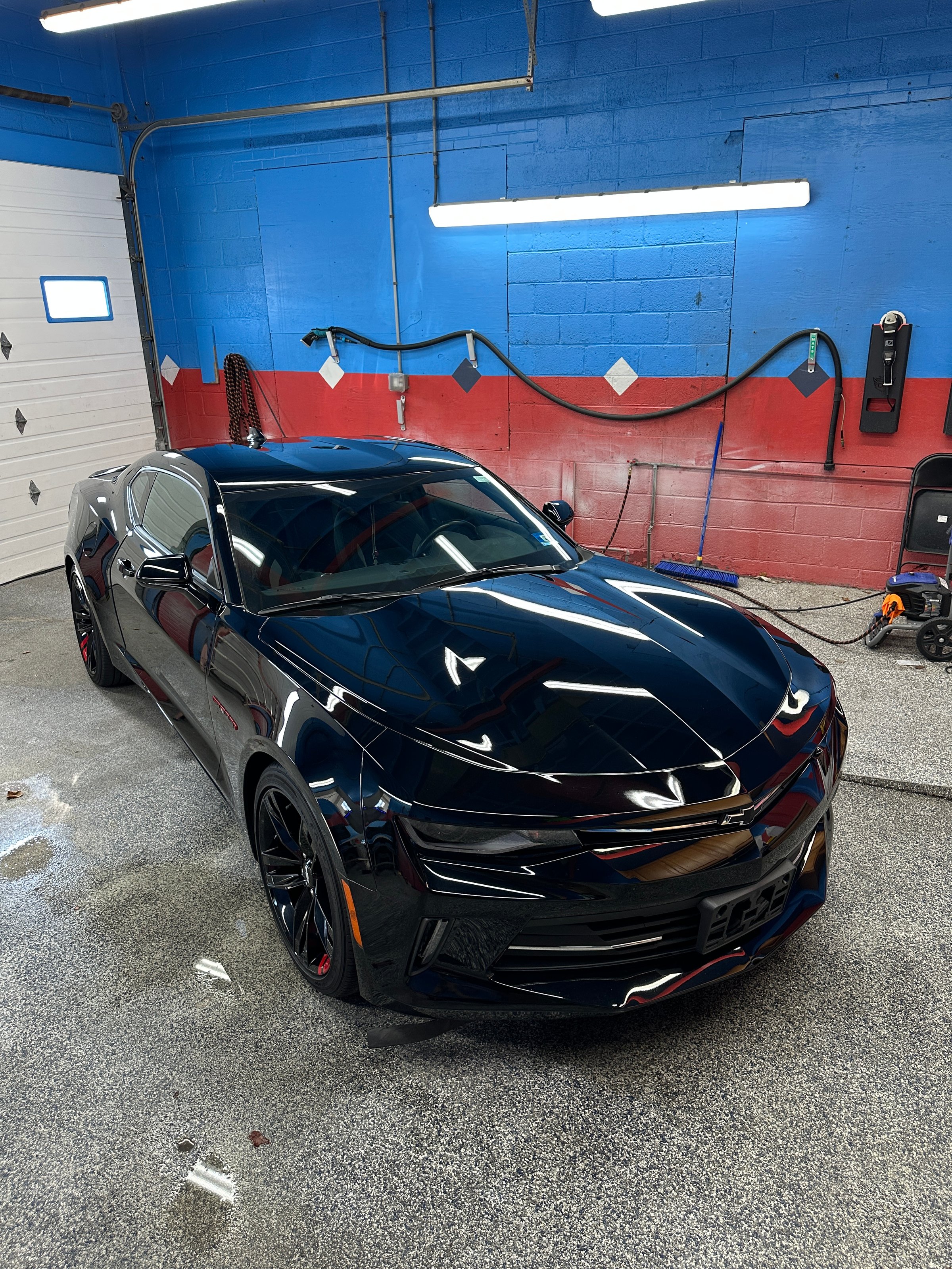 White vehicle showcasing exceptional detailing work with pristine exterior finish