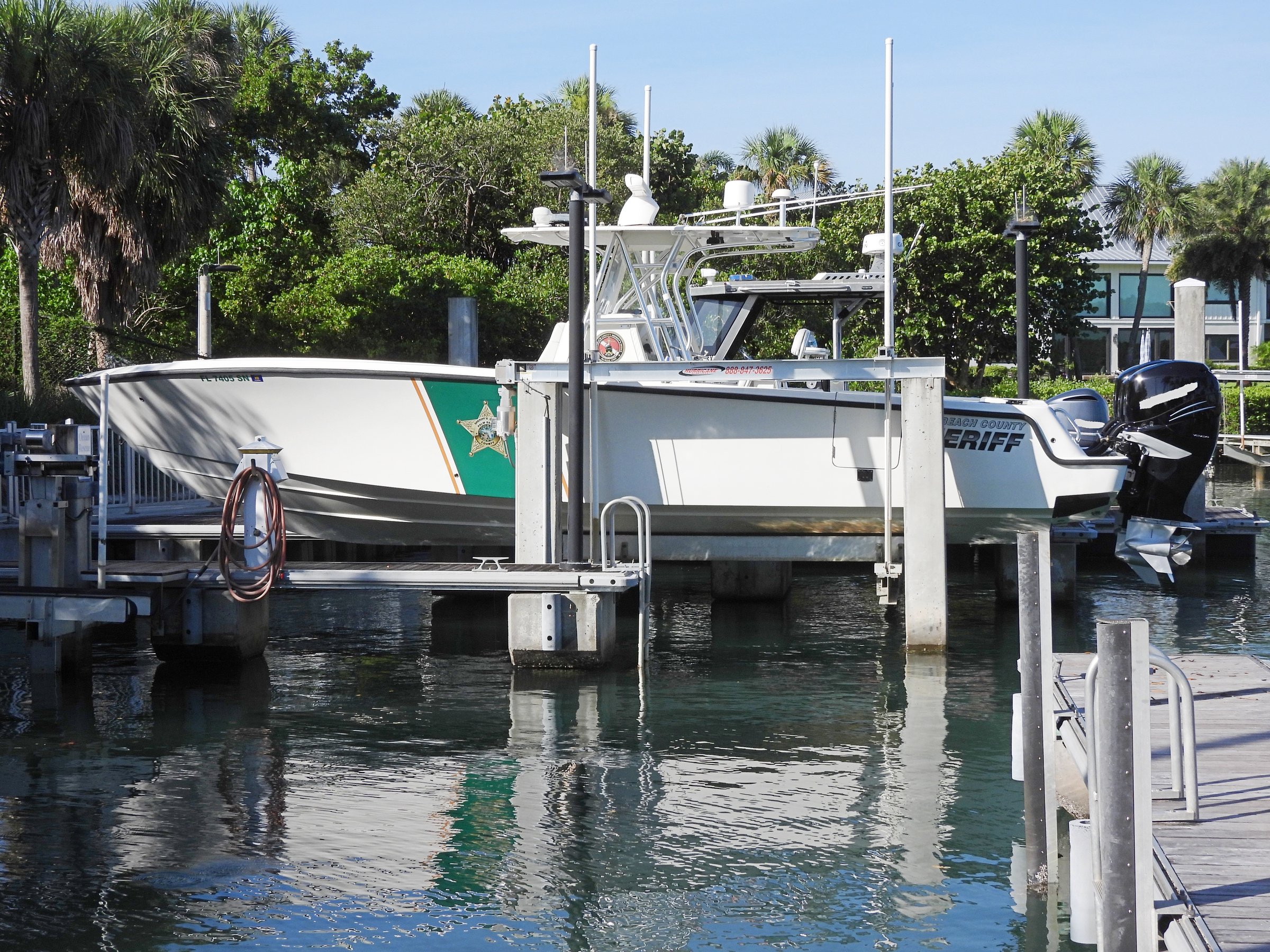 Jupiter, Palm Beach County, Florida, USA June 21, 2024. Palm Beach County Sheriff's Marine Unit (PBSO) on a boat lift. Used to intercept Immigrant's, rescue to save lives, missing people and capsized vessels. PBSO patrols the intracoastal waters and conducts enforcement of observed violations. Officers issue warnings and citations for vessel violations and deficiencies. They ensure the safety of everyone who utilizes the waterway.