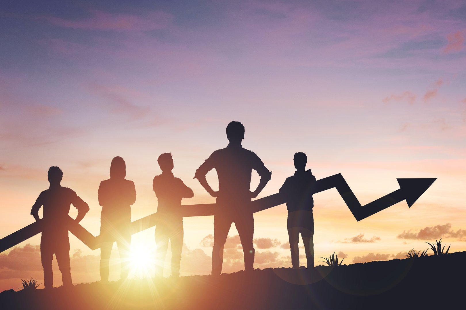 Team silhouette and up graph arrow on sunset background, leadership and teamwork concept.