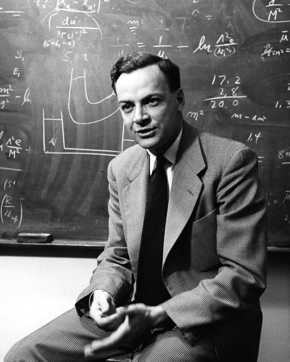 Richard Feynman teaching philosophy - smiling student writing equations on whiteboard, representing clear and engaging mathematics education
