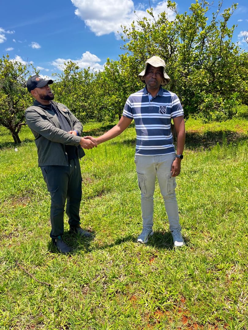 Kabelo Letsoalo and Matome Letsoalo sealing land agreement in DRC