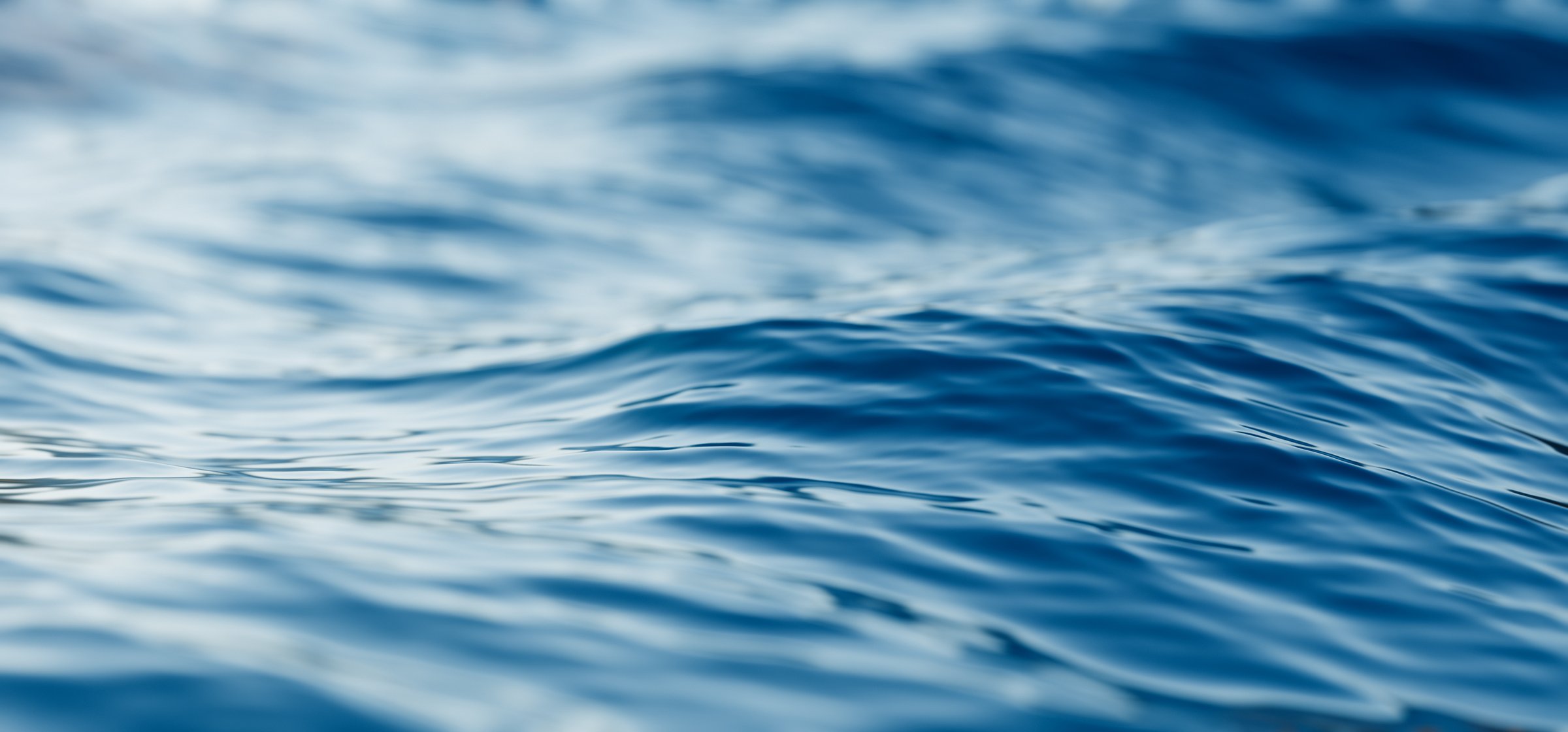 A closeup view of blue ocean waves, morning ocean, sunset sea, nature background. 3d render