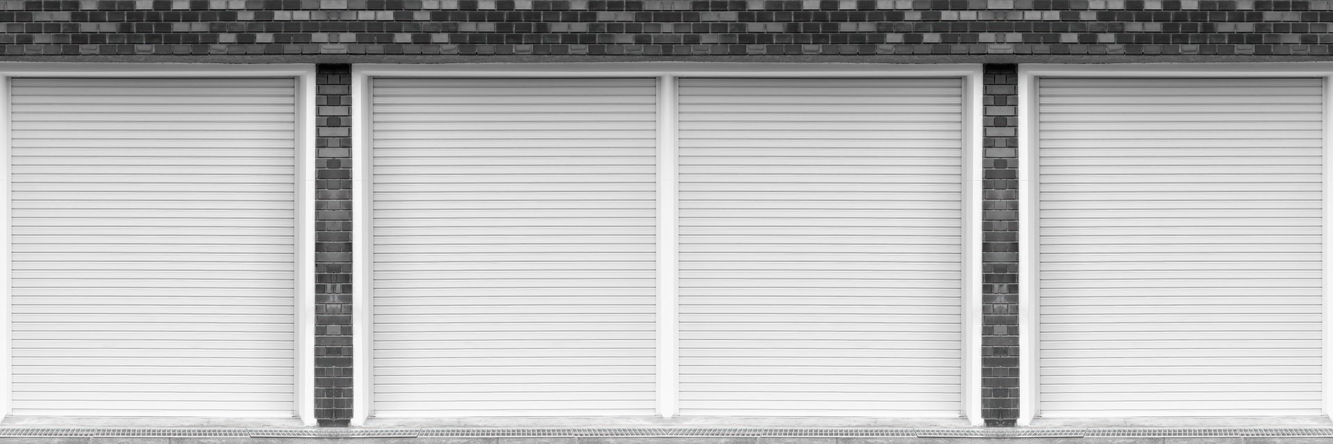 Closed steel shutter doors of warehouse, storage or storefront for metal door background banner template.