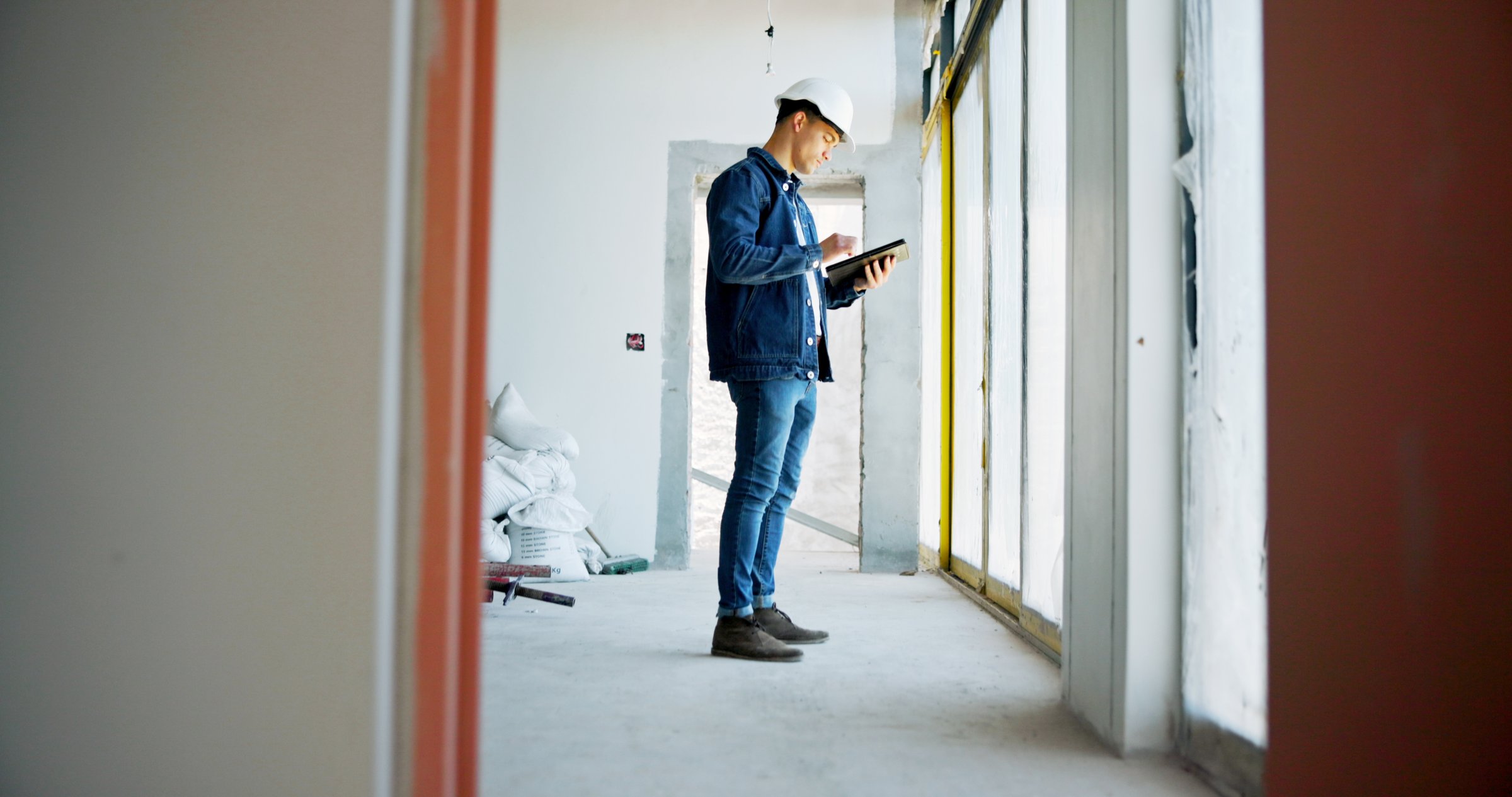 Man, tablet and inspection for renovation at property with scroll, contact and check notification for deal. Person, architect or engineer with digital touchscreen, app and checklist for real estate