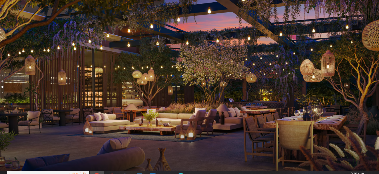 Outdoor restaurant with cozy seating, hanging lights, and lush greenery at sunset.