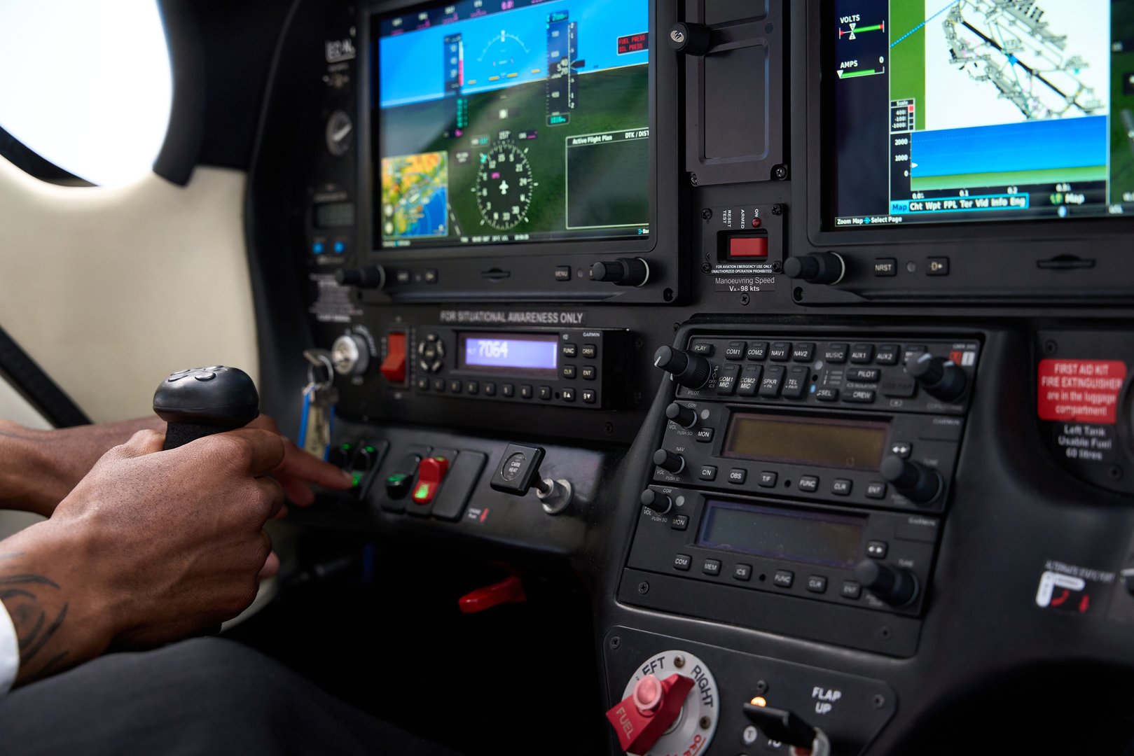 Close-up view of pilot's hands skillfully operating controls in an aircraft flight simulator cockpit, immersed in advanced aviation training