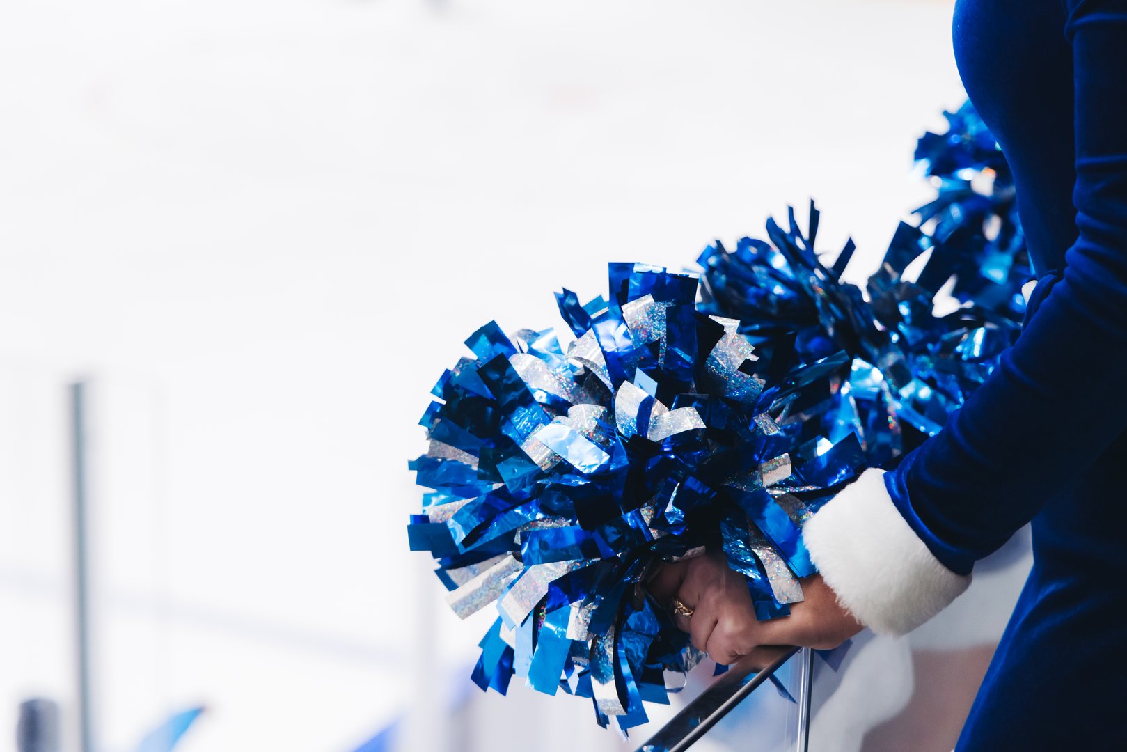 Female cheerleaders group in action performing during sports game