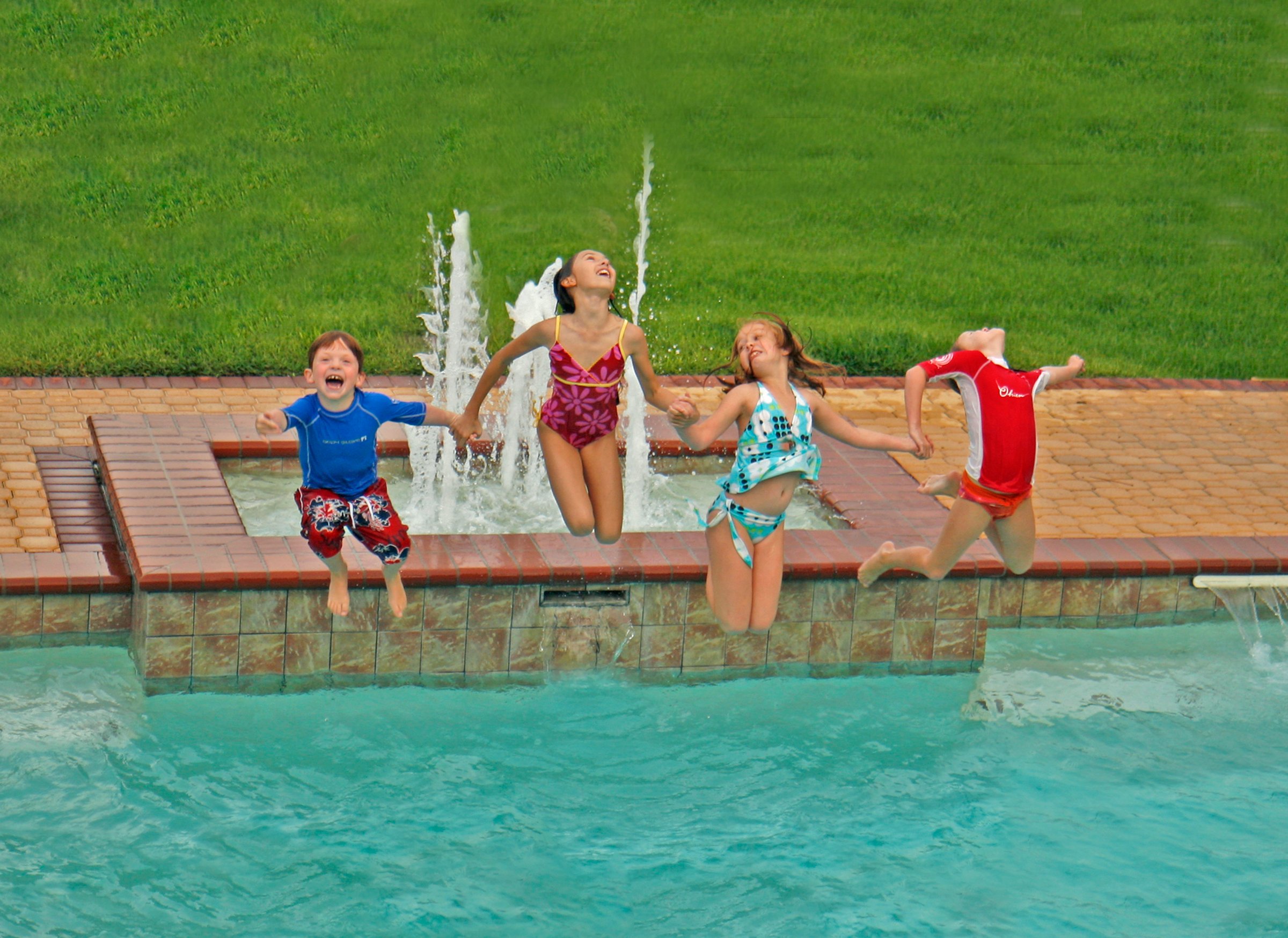 Happy kids enjoying a clean swimming pool