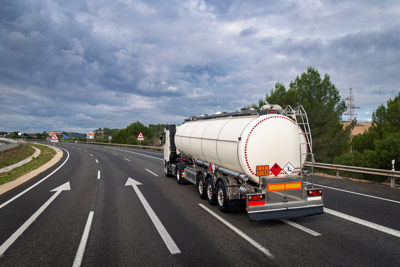Hazardous materials tanker truck transporting flammable liquid on a highway