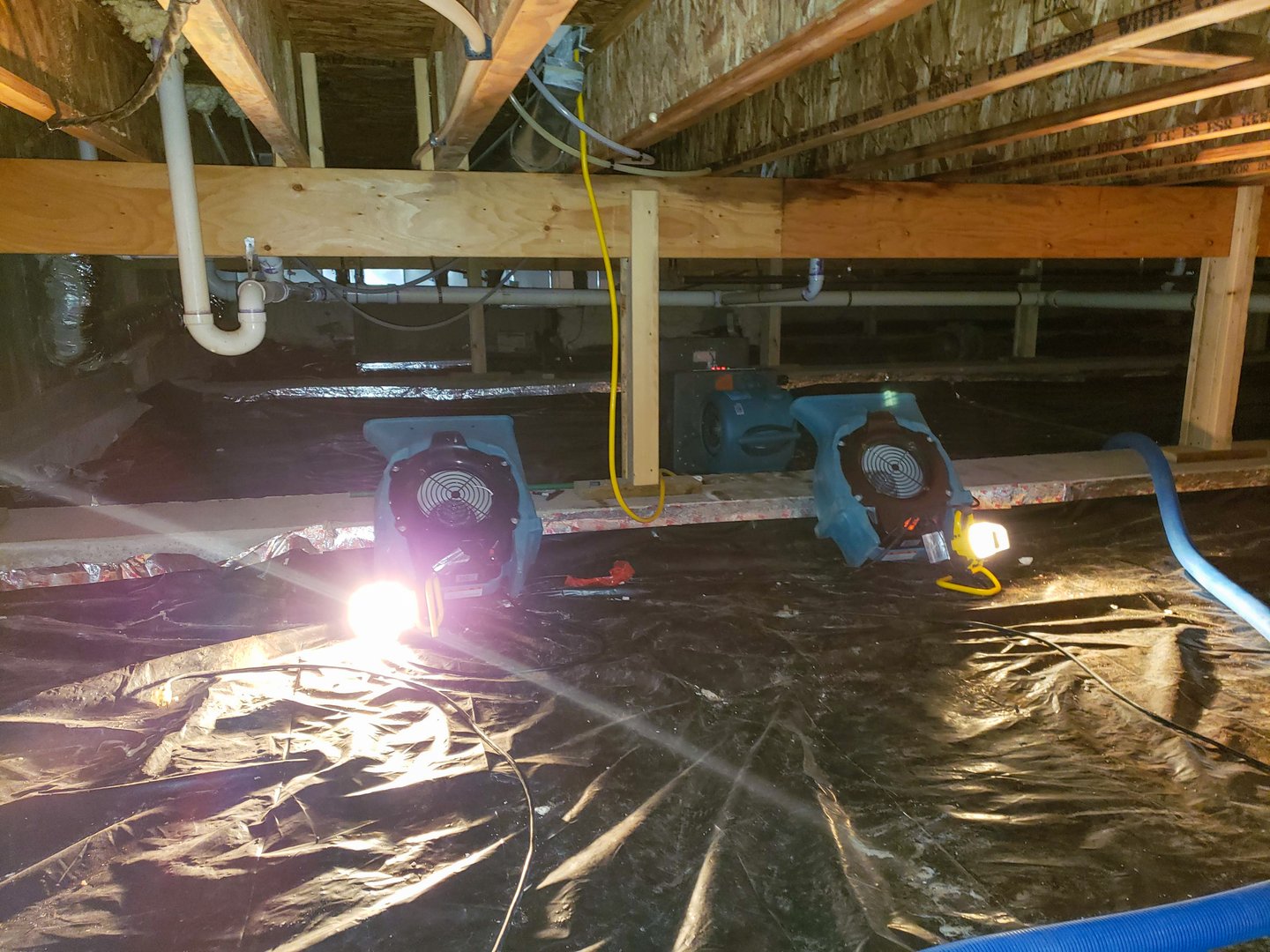 A crawl space with air mover to dry out the structure