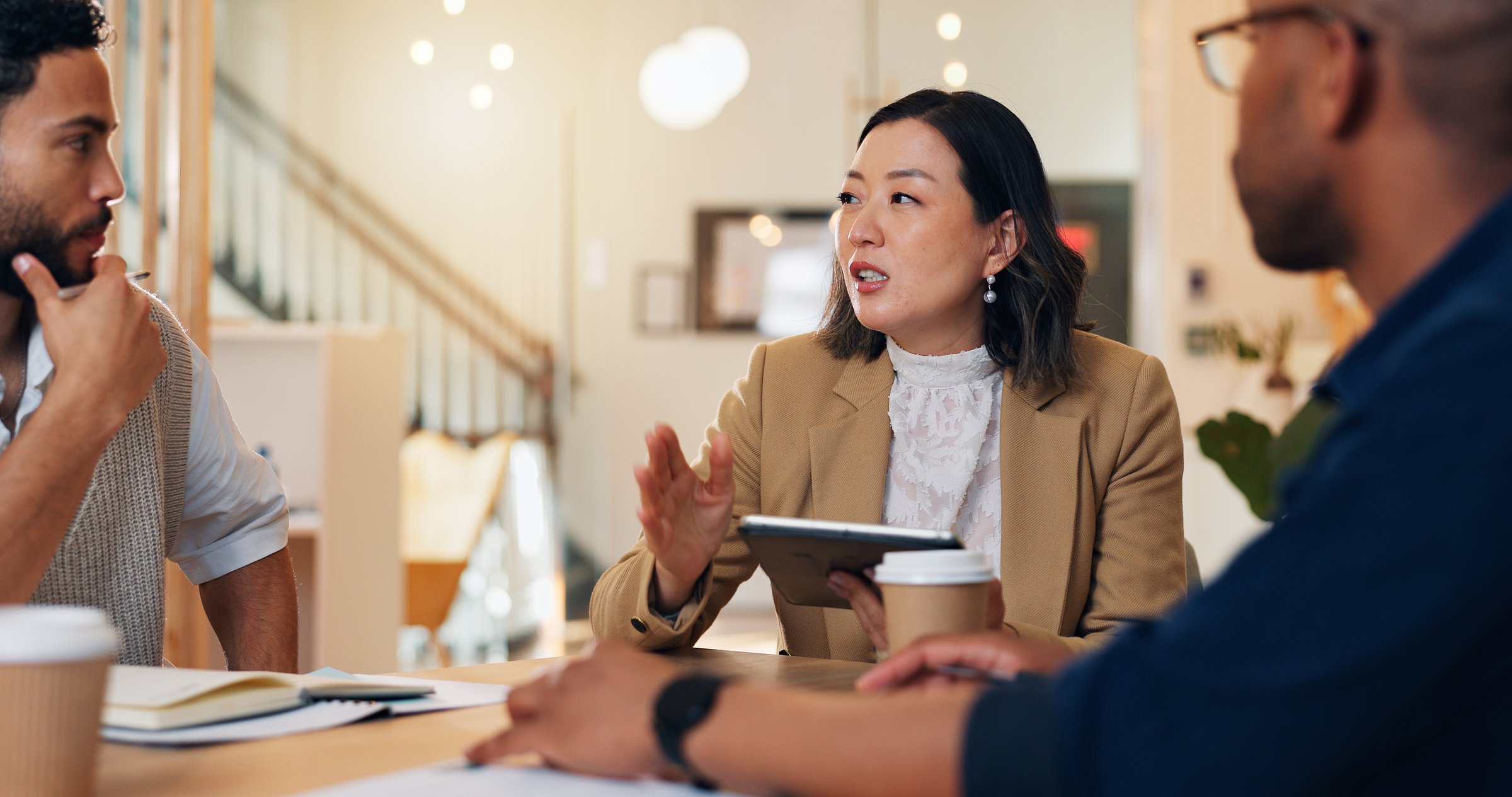 Woman, men and discussion with tablet for planning event, wedding or ceremony with budget, notes and app. People, meeting and leader with touchscreen for party, gala and project management at startup