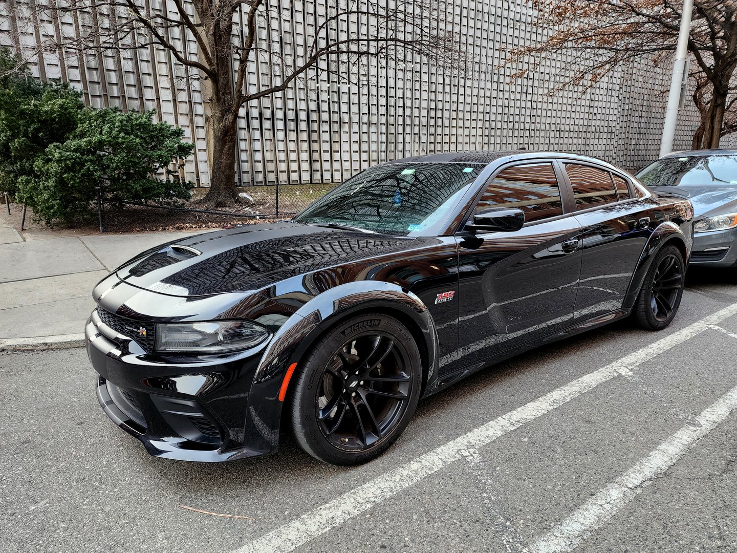 New York City, USA - March 01, 2024: 2020 Dodge Charger SRT Hellcat automotive brand car parked outside, angle view.