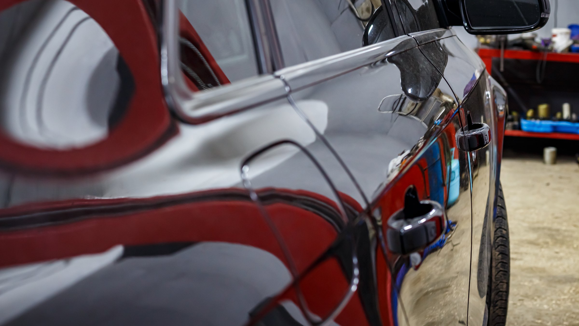 Black passenger car at the service station.