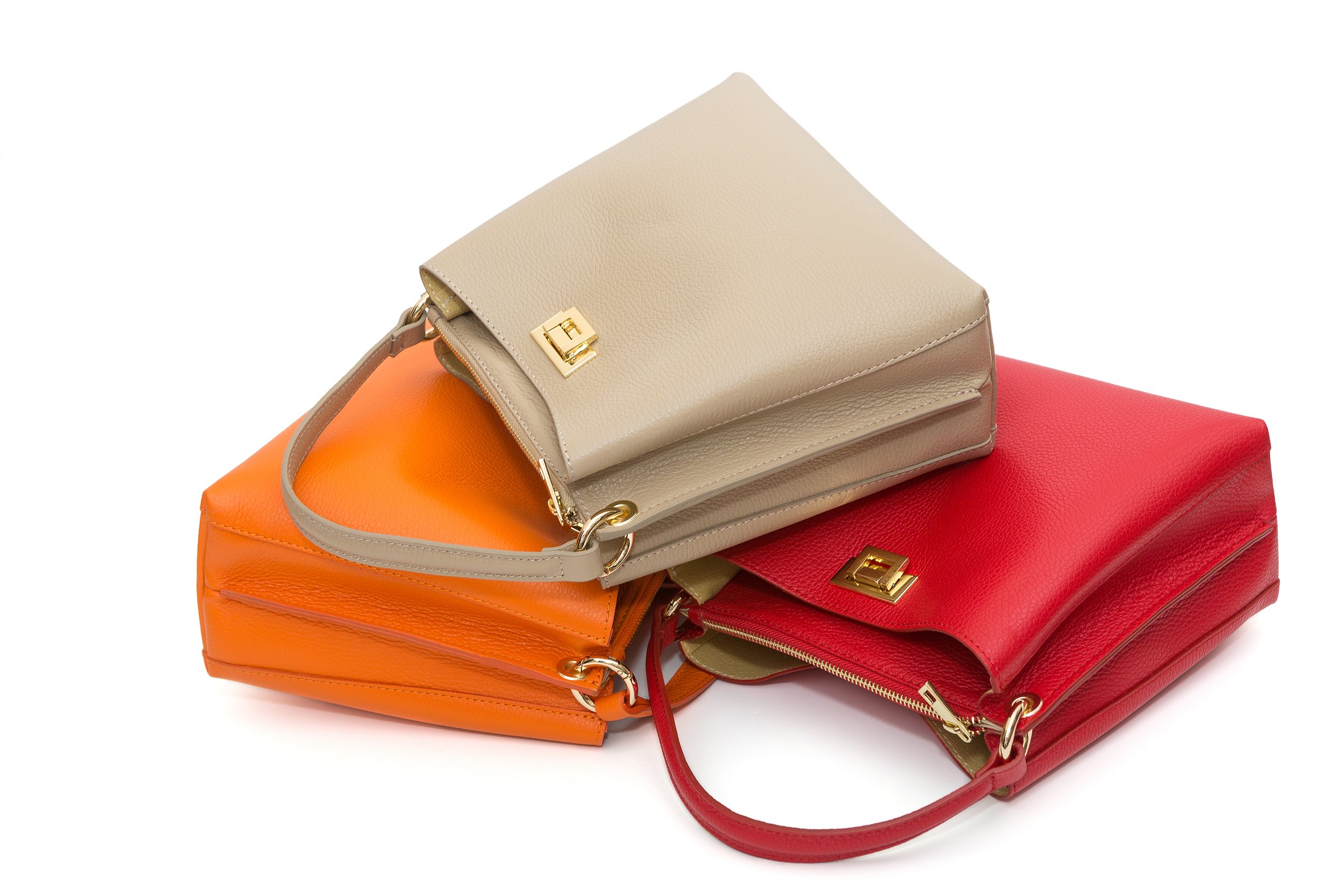 Collection of multi-colored women's bags, isolated on a white background