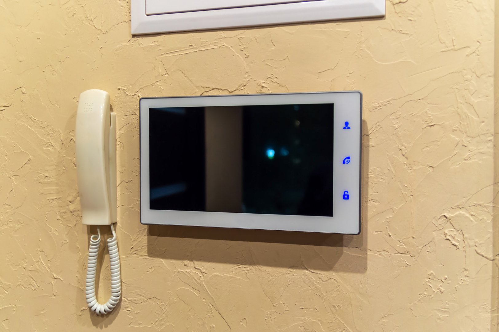 Video intercom on the wall. Selective focus