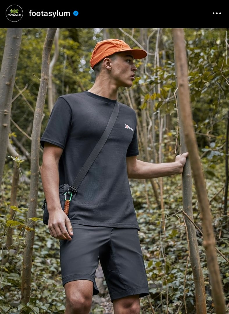 Outdoor fashion model showcasing Berghaus for Footasylum, wearing bag and hat