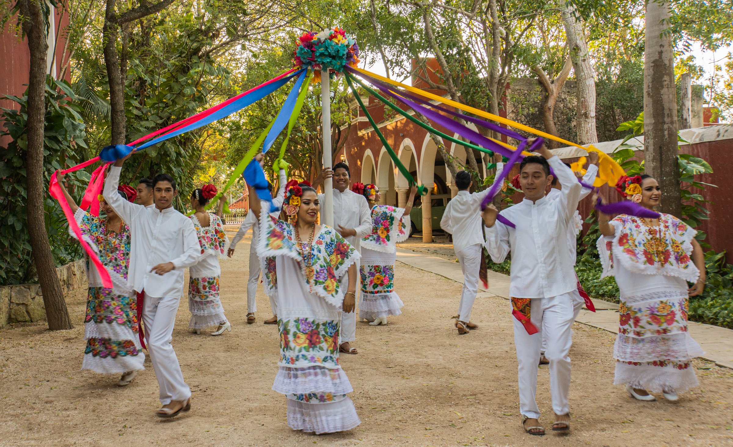 Merida,Yucatan/Mexico-February 29,2020: folk dancers performing the maypole dance  dressed in traditional costumes