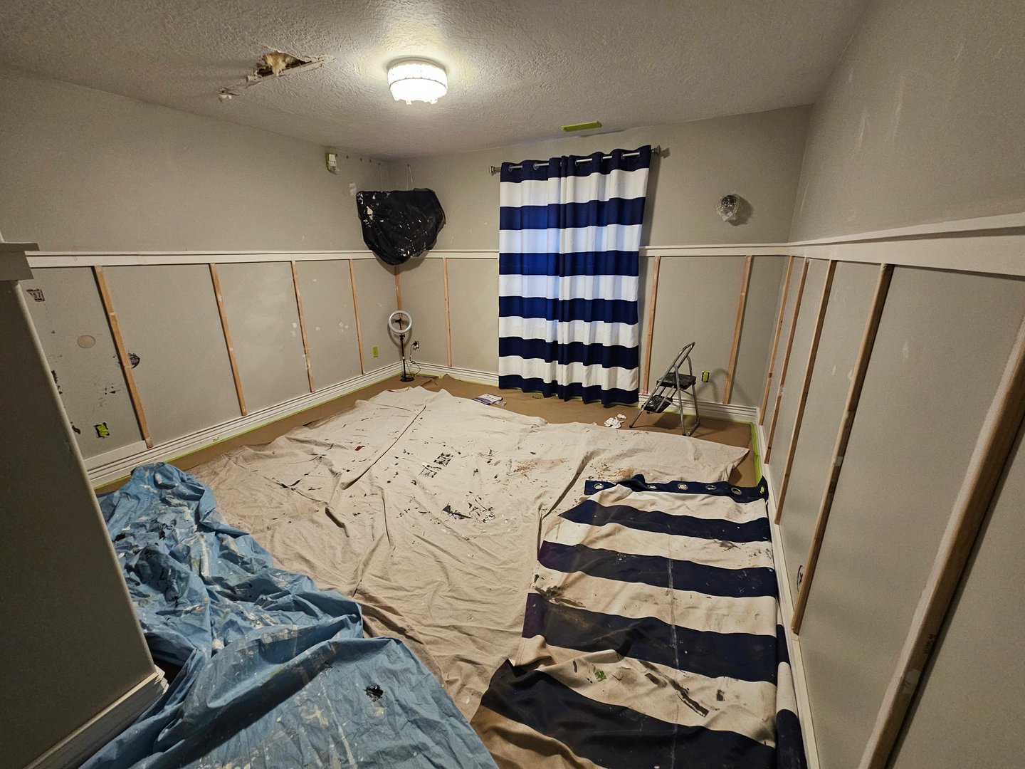 Board and batten wall treatment painted in Behr Ecological green