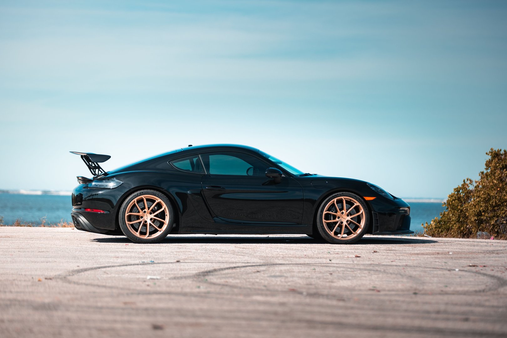 Saint Petersburg, United States – January 02, 2025: A sleek 2021 black Porsche GT4 on an asphalt road