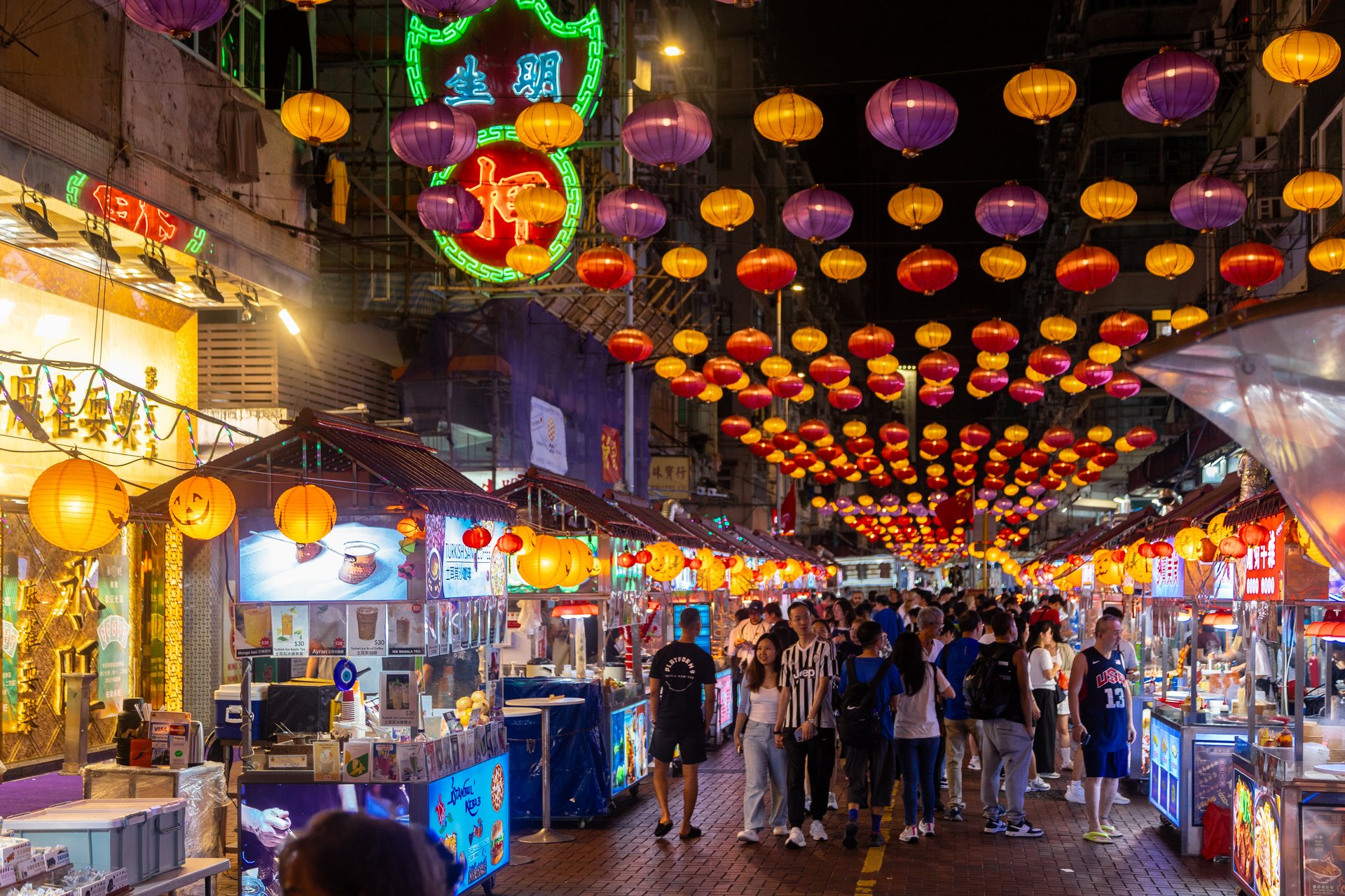 Kowloon, Hong Kong - 20 October 2024 - Food and street market at Temple Street Night Market in the heart of Kowloon, which is famous for the bustling combination of restaurants, performers and street vendors. It is one of the best places to experience the most colourful side of local culture during evening time