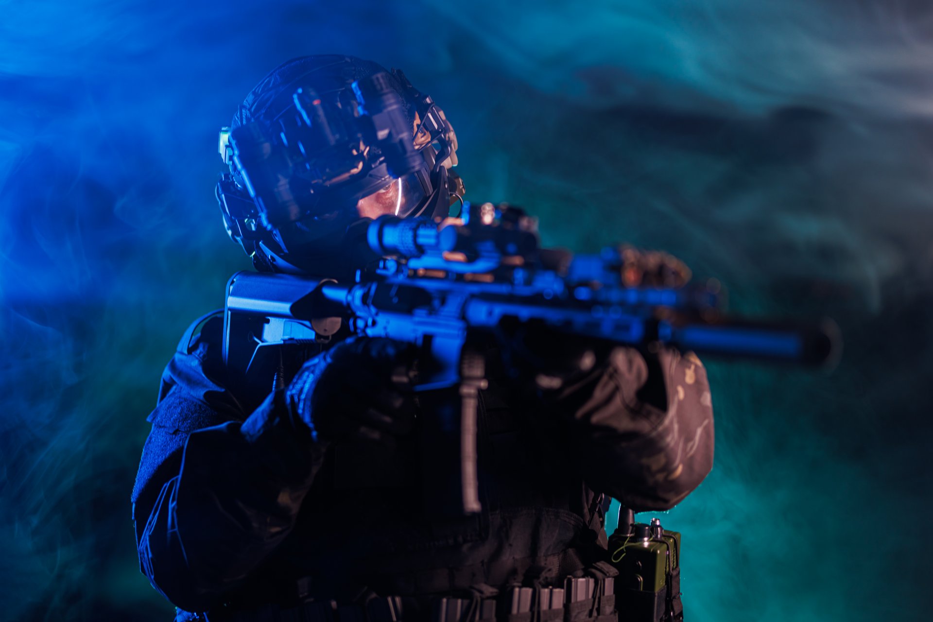 Special forces operator dressed in tactical equipment, aiming a rifle, in a dramatic scene with contrasting atmospheric lighting and a foggy backdrop, portraying intensity, seriousness, and a focused mission objective.