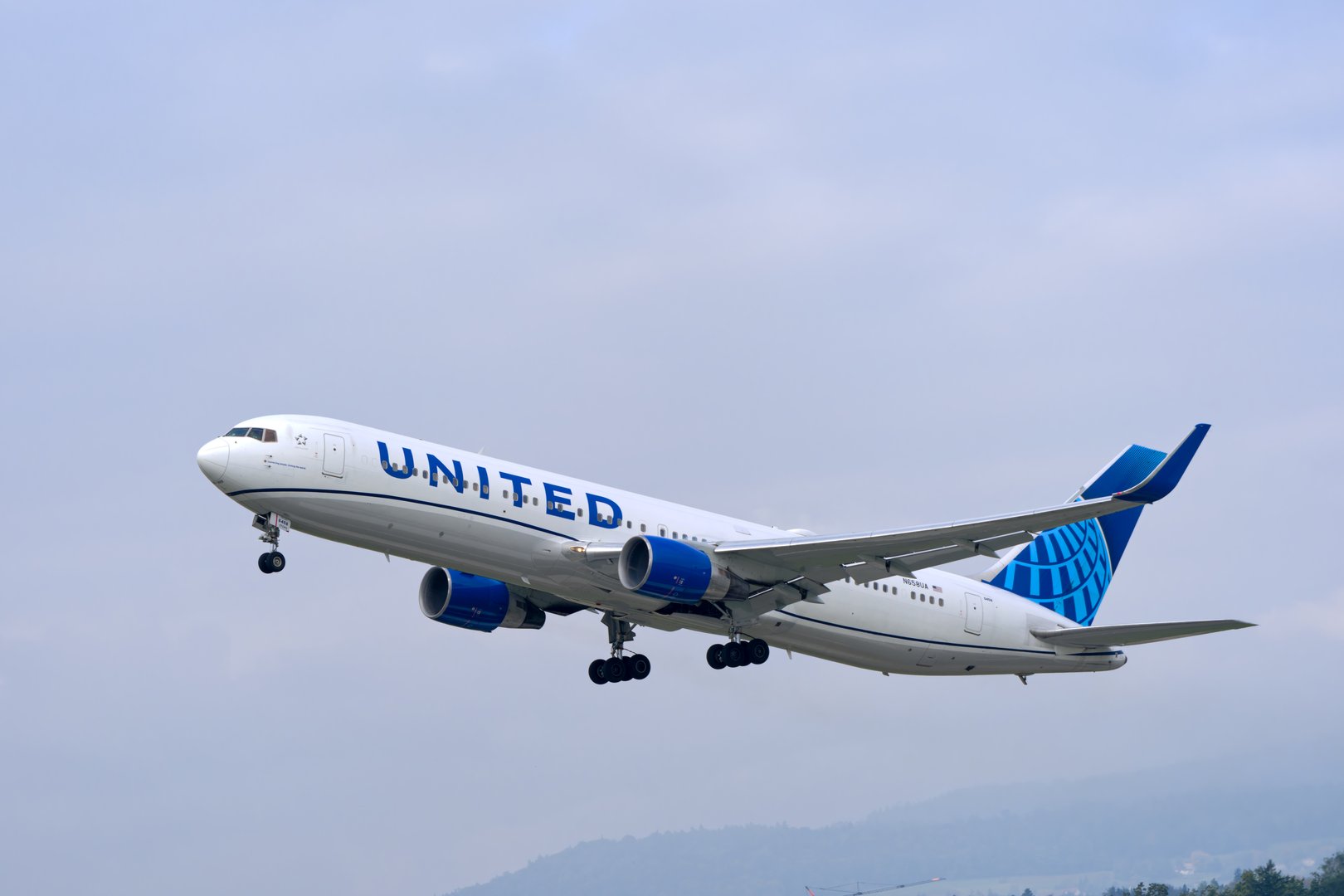 United Airlines passenger airplane type Boeing 767-300 N658UA registration taking off from Swiss Zurich Airport on a cloudy autumn day. Photo taken September 29th, 2025, Zurich Kloten, Switzerland.