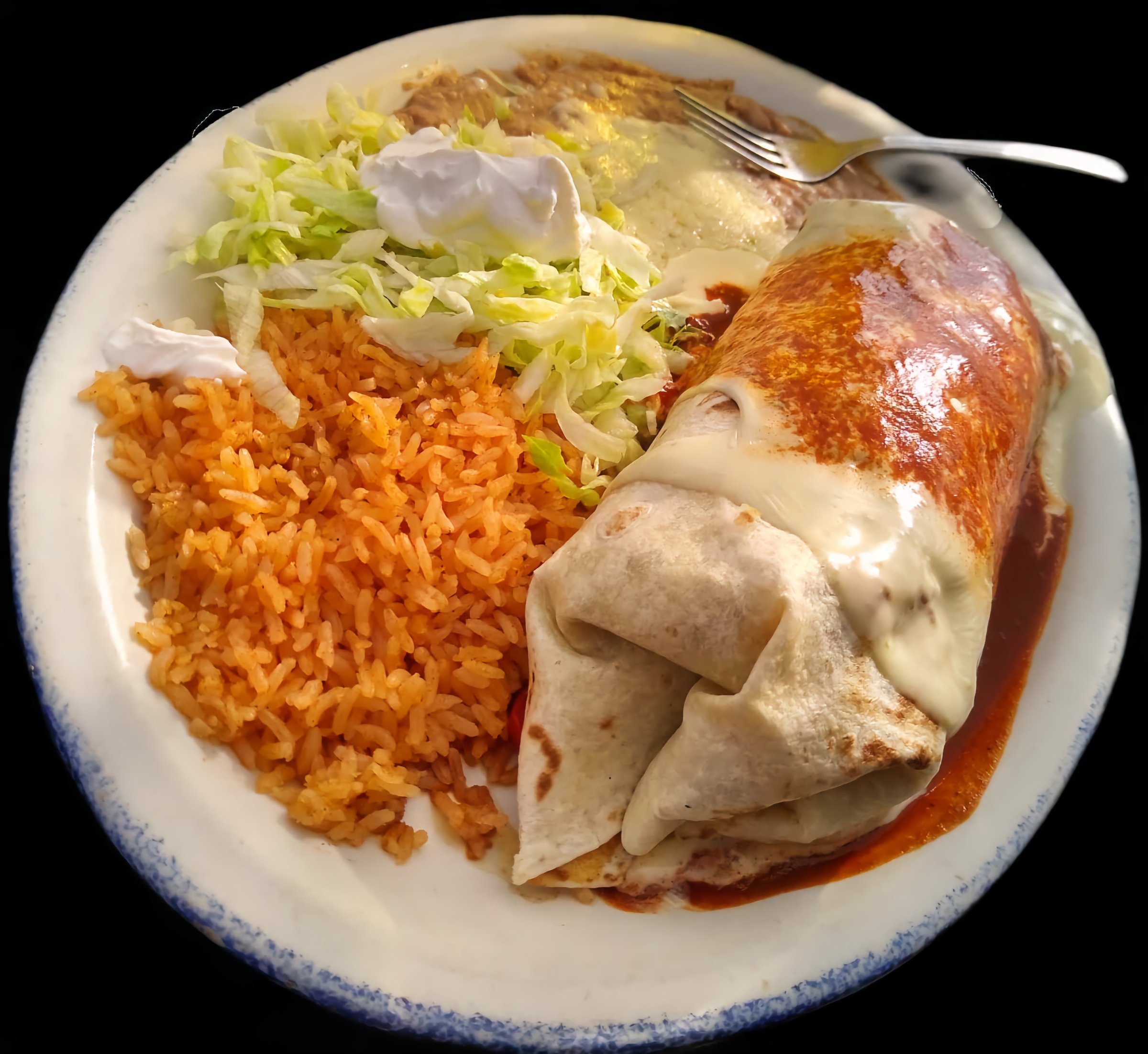 Burrito with rice, beans and lettuce