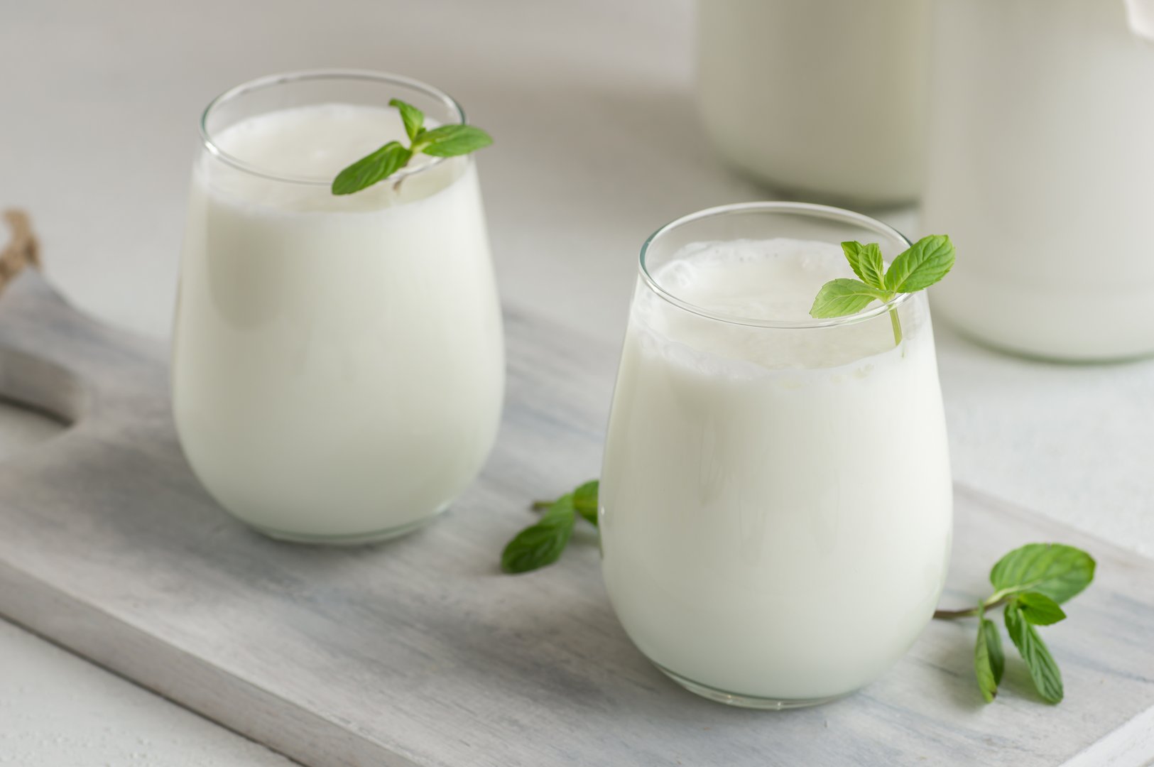 Glass cup of Turkish traditional drink ayran , kefir or buttermilk made from yogurt, healthy food