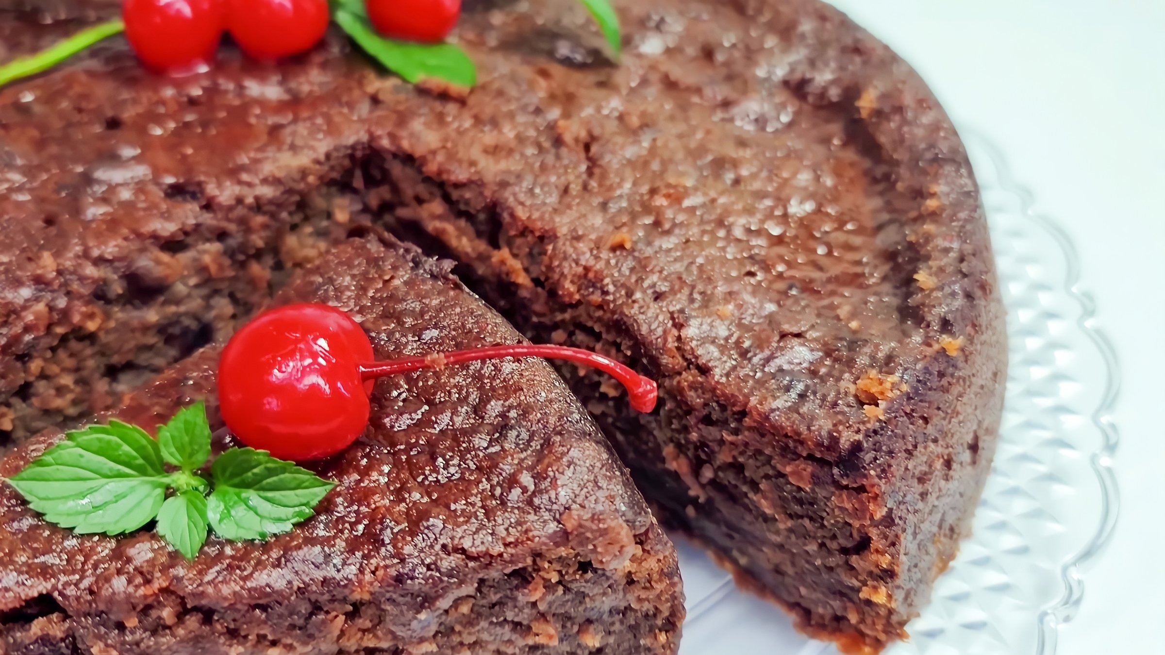 Chocolate cake with juicy cherries. Fruit cake or Rum cake