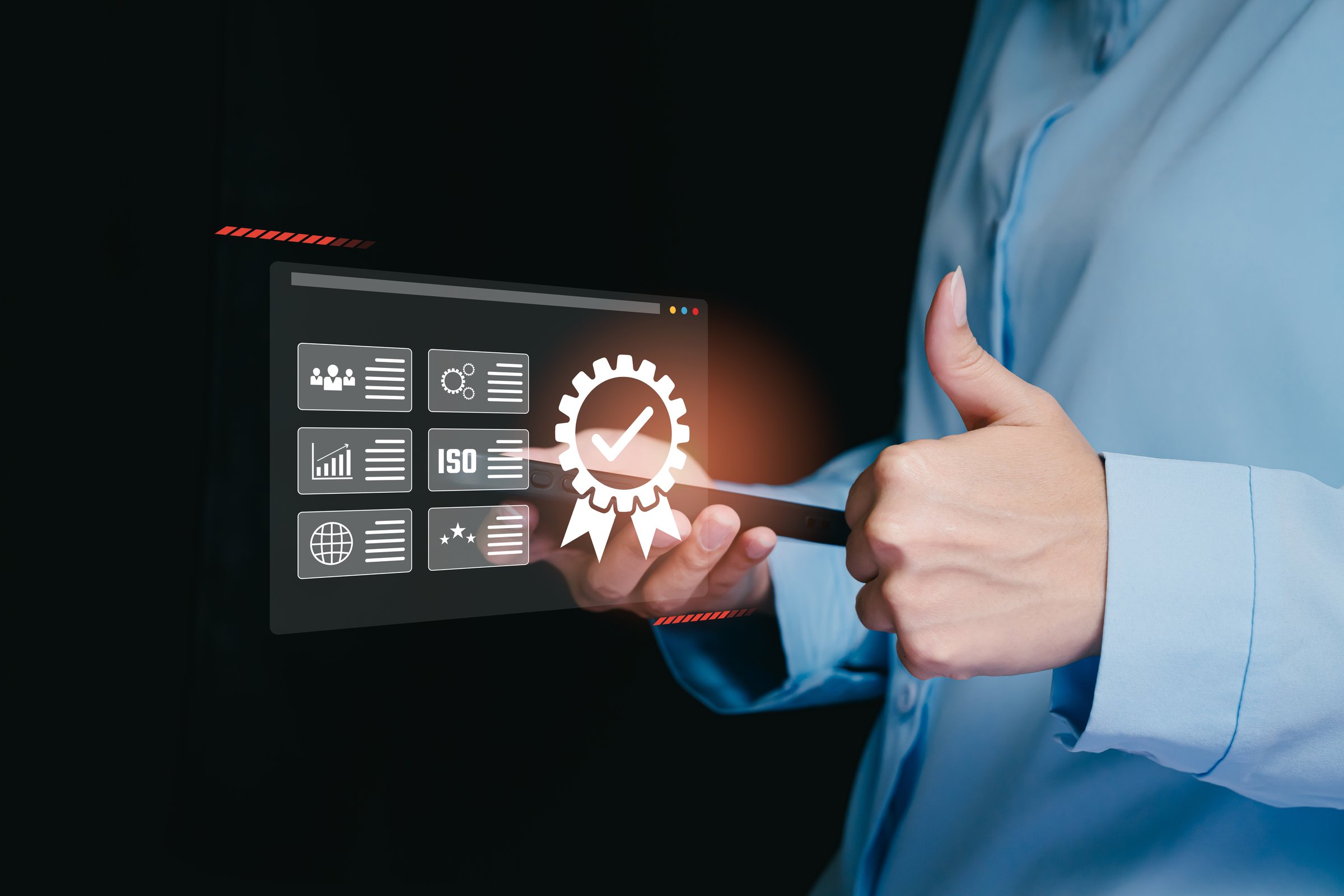 Professional Business Person Using Technology for Quality Assurance and ISO Certification in Modern Workplace Environment.