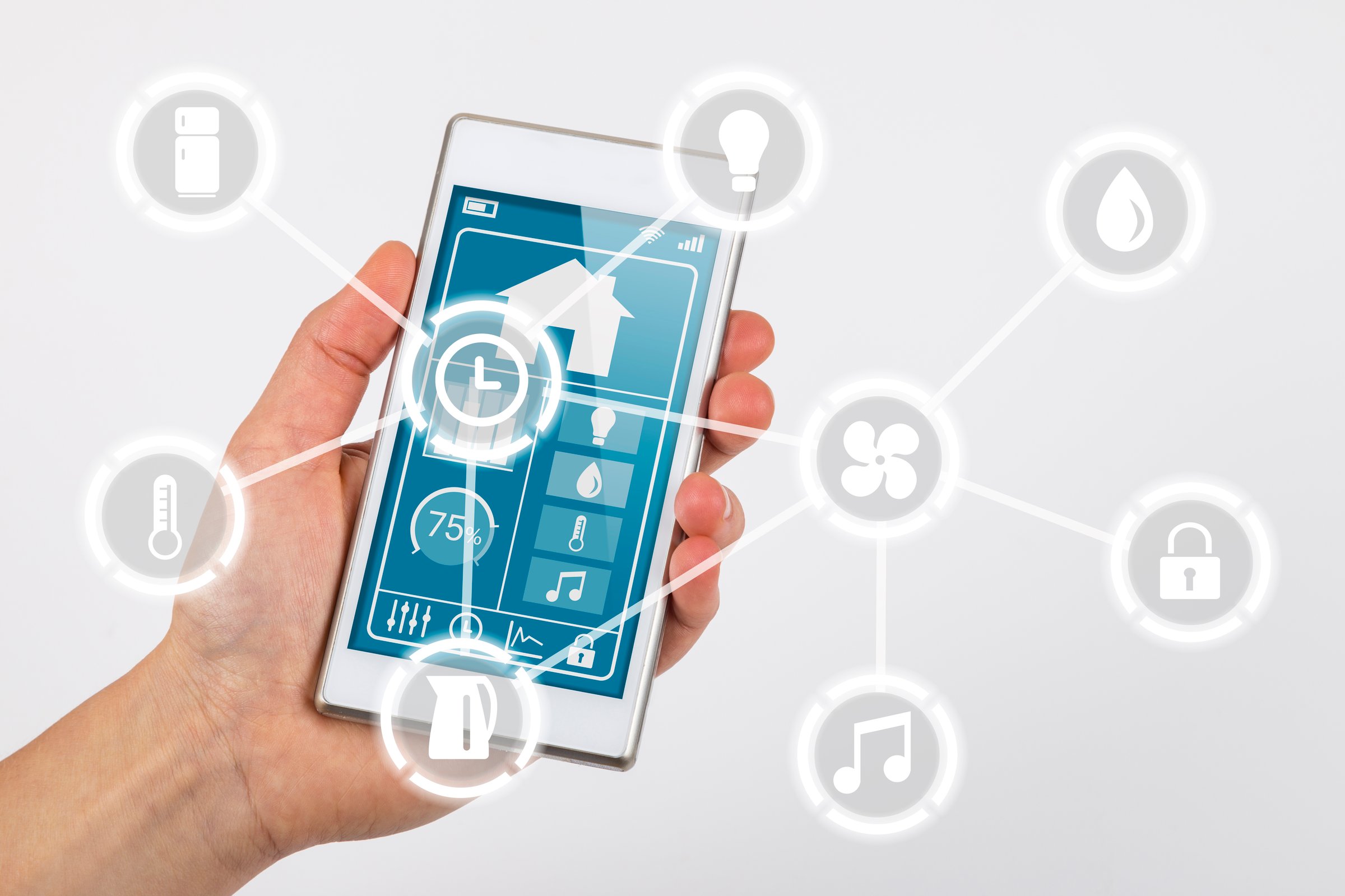 Smartphone used for controlling devices in smart home interconnected over the Internet of Things. Icons for different devices overlaid on image showing network concept.