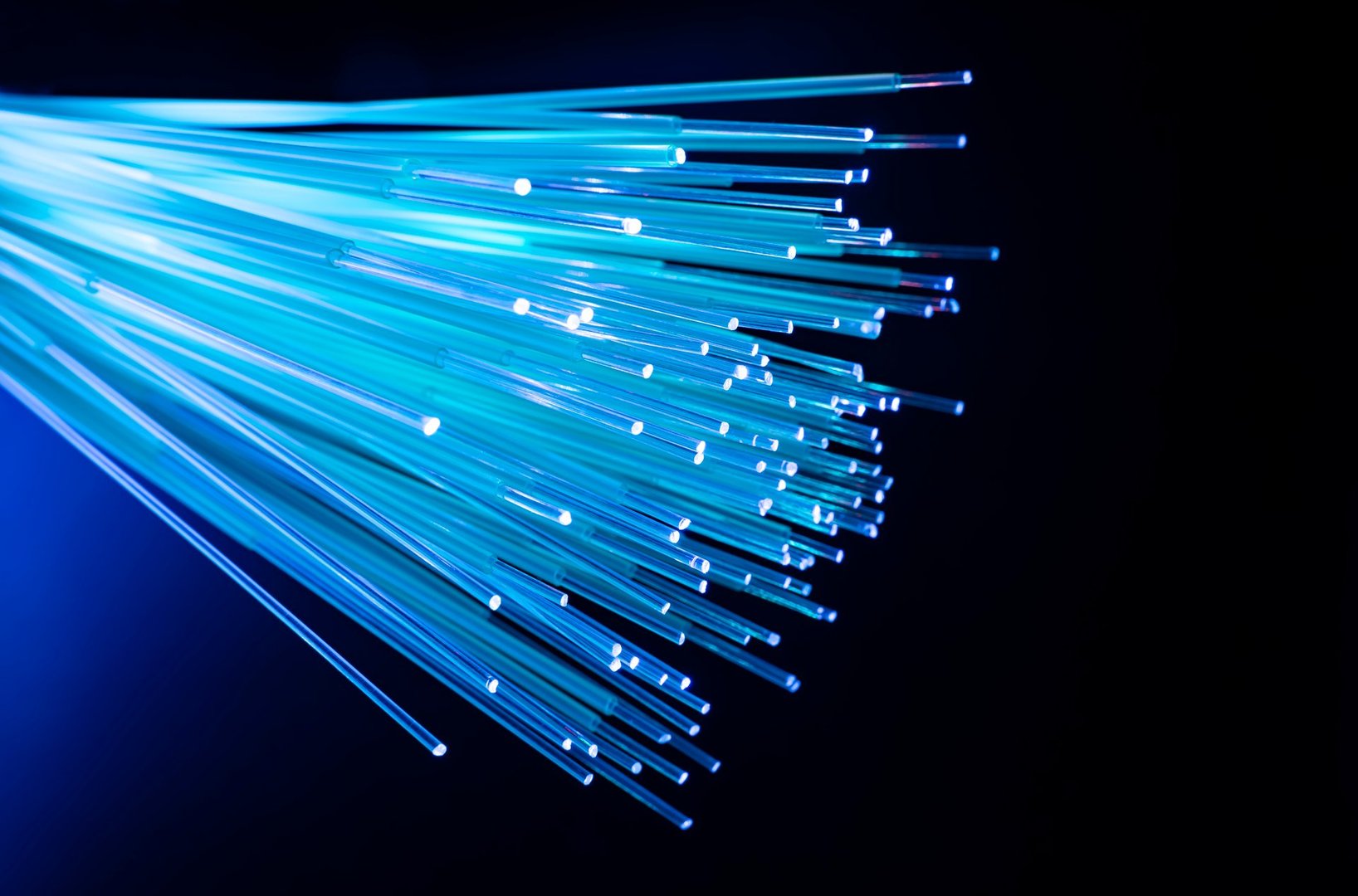 fiber optics network cable for ultra fast internet communications, thin light threads that move information at high speed.